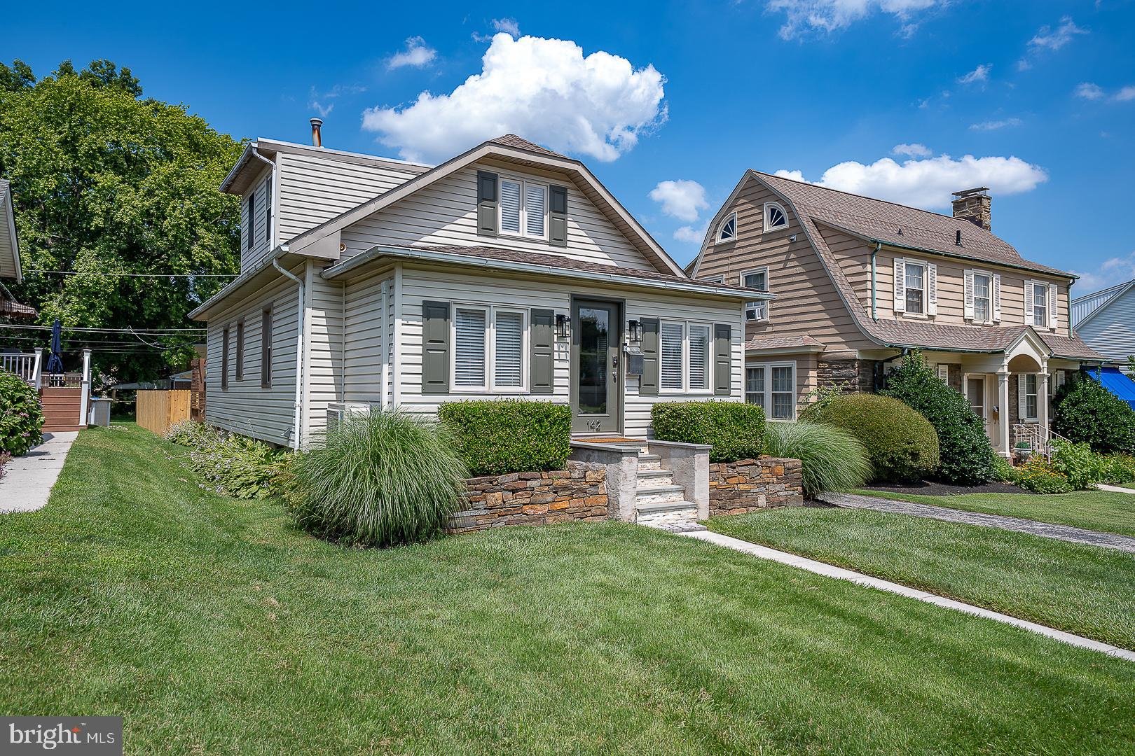 Welcome to 142 E. 14th Street – a beautifully updated single-family residence nestled in the heart of highly coveted Conshohocken. This exceptional 3 Bedroom, 2 full Bath home masterfully combines timeless charm with modern sophistication, offering a spacious finished Lower Level, thoughtfully curated upgrades throughout, and an impressive oversized rear yard perfect for entertaining or relaxing in privacy. Recent high-end enhancements include a brand new roof (2025), refinished rear deck (2025), newly installed backyard fencing (2025), new exterior shutters and lighting, as well as solar accent lighting to enhance curb appeal. Step inside to find an exceptional 1st Floor Bath remodel with heated floors (2024), mini-split climate systems in the front entry Sunroom and Lower Level (2024), and fresh, contemporary interior paint throughout. The Main Level showcases rich hardwood flooring and a sun-drenched, open-concept layout. The inviting front Sunroom—ideal for a Home Office or Playroom—flows effortlessly into a spacious living area and a chef’s Kitchen appointed with 42” white cabinetry, granite countertops, a peninsula with bar seating, stainless steel appliances (including a new refrigerator and dishwasher, 2023), a 4-burner gas range, and stylish tile backsplash and flooring. A vaulted Breakfast Room with skylight and atrium doors opens to the rear deck, creating a seamless indoor-outdoor lifestyle. Two well-proportioned Bedrooms and a spa-inspired Hall Bath complete the Main Level. Upstairs, you’ll find a charming Loft with closets and a spacious Primary Suite featuring built-in wall storage drawers and a stunning en-suite luxury Bath with frameless glass shower. The finished Lower Level offers a versatile space ideal for a Media Room or Home Office, complete with a bar area, large storage room, laundry hookups, and utility sink. The outdoor setting is equally impressive, with a private, fully fenced backyard, storage shed, and generous driveway offering off-street parking for four vehicles. Perfectly located just a short walk to Conshohocken’s vibrant dining scene, parks, and the Schuylkill River Trail, this home offers convenient access to Routes 76 and 476 and is situated within the top-rated Colonial School District. Don’t miss your opportunity to own this extraordinary home that truly has it all.
