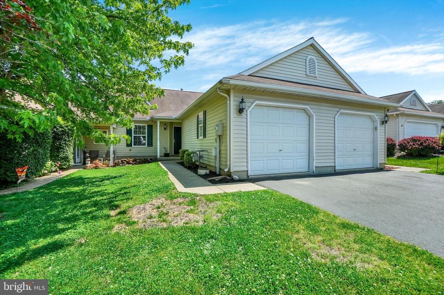Discover effortless one-floor living in this beautifully updated 2-bedroom, 2-bath ranch-style condo located in the sought-after Dallastown Area School District. Every detail has been thoughtfully enhanced to create a warm, modern atmosphere, from the eye-catching fireplace feature wall and custom wood mantle to the upgraded lighting fixtures found throughout the home.

The kitchen is designed with practicality in mind, featuring a convenient corner pantry for added storage. The spacious primary suite offers a sophisticated board-and-batten accent wall and a beautifully refreshed en-suite bath complete with shiplap accents, chic gold finishes, and unique tile flooring that adds character and charm.

Enjoy indoor-outdoor living with sliding doors leading to a private patio overlooking a fenced area and generous green space beyond — perfect for relaxing, entertaining, or enjoying the outdoors. Move-in ready and filled with tasteful upgrades, this condo offers the perfect blend of comfort, style, and convenience.