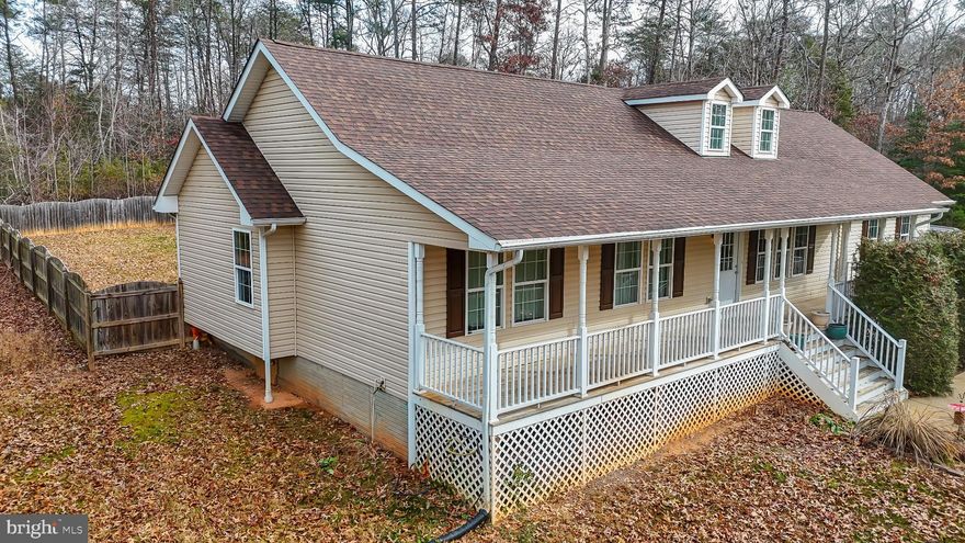 Gated community nestled within the serene enclave of Lake Anna Woods, this exquisite ranch-style residence offers a harmonious blend of luxury and comfort, perfect for those seeking an elevated lifestyle. This thoughtfully designed home features three spacious bedrooms and two full bathrooms, ensuring ample space for relaxation and rejuvenation. Step inside to discover an inviting open floor plan that seamlessly connects the living and kitchen areas, ideal for both entertaining and everyday living. The interior boasts stunning wood floors that exude warmth, complemented by recessed lighting and skylights that flood the space with natural light. The combination kitchen and living area is a chef's dream, equipped with high-end stainless steel appliances, all designed to elevate your culinary experiences. The home's thoughtful design extends to its outdoor spaces, where you can unwind on the expansive  porch, or back deck surrounded by the tranquility of nature. The property spans over 2.14 acres, backing to lush trees that provide a sense of privacy and seclusion. Enjoy the beauty of the outdoors while being just moments away from the shimmering waters of Lake Anna, where you have private access for boating, fishing, and swimming. As part of a gated community, residents benefit from exclusive amenities, including a boat ramp, common grounds, and pier/dock maintenance, ensuring that your leisure activities are always within reach. The association also provides security gate access and road maintenance, allowing you to enjoy peace of mind and a well-maintained environment. For those who appreciate the finer things in life, this home offers not just a residence but a lifestyle. With its proximity to Lake Anna, you can indulge in water sports, leisurely canoeing, or simply basking in the sun by the water's edge. The attached garage provides convenient storage and easy access, while the driveway offers additional parking for guests. This property is more than just a home; it's a sanctuary where luxury meets nature, inviting you to create lasting memories in a setting that feels both exclusive and welcoming. Experience the perfect blend of comfort, elegance, and outdoor adventure in this remarkable Lake Anna Woods residence.