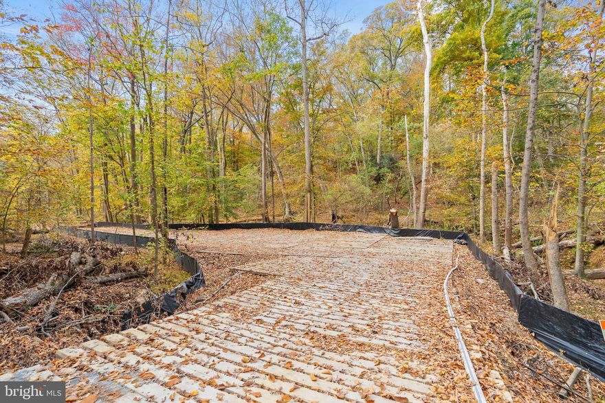 Ready to build and full of potential! This subdividable lot is all set with public water, sewer, and electricity in place, making your building process easier. The cleared roadway, with 16 inches of blue stone gravel, is wide enough for emergency vehicles to access, so all that's left to do is excavate and start building! A proposed home plan is available, and the parcel meets county requirements to be subdivided into 2-3 lots—perfect for multiple homes or a custom layout. Tucked away in a peaceful, private setting surrounded by mature trees, yet only minutes from beltways, shopping, dining, and entertainment. A rare opportunity in a prime location!