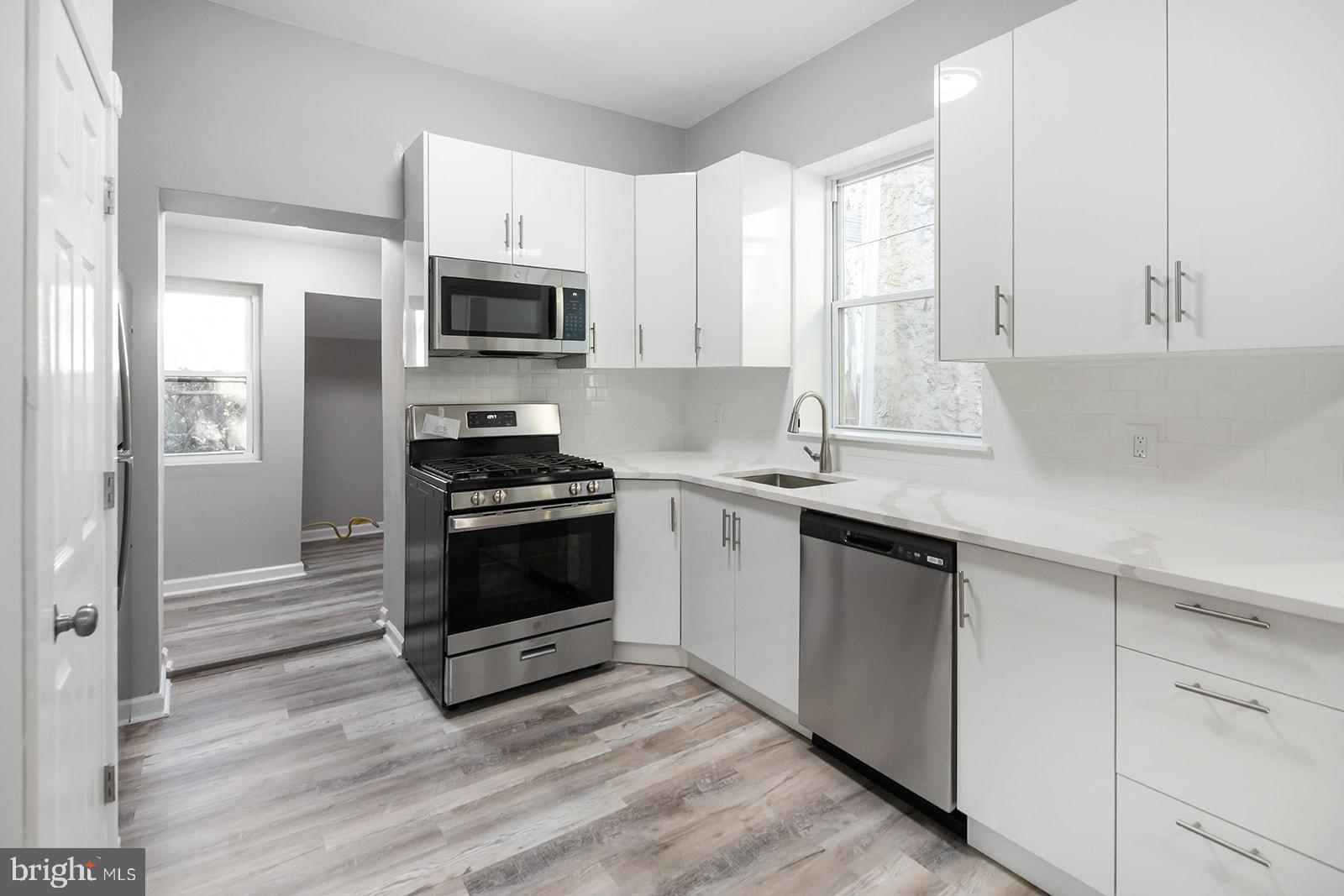 Step into this beautifully renovated, 1400+ square ft, 4-bedroom, 1-bath home featuring high-end finishes, a spacious open floor plan, and tall ceilings. Enjoy a stunning kitchen with brand-new stainless steel appliances, custom cabinetry, and sleek stone countertops. Luxury flooring runs throughout, and the home is equipped with central heating and cooling for year-round comfort. Additional features include main floor laundry hook-up, an unfinished basement for extra storage or potential, and a prime location in the heart of Strawberry Mansion. Move-in ready and full of charm—this one won’t last! Schedule your showing today.
