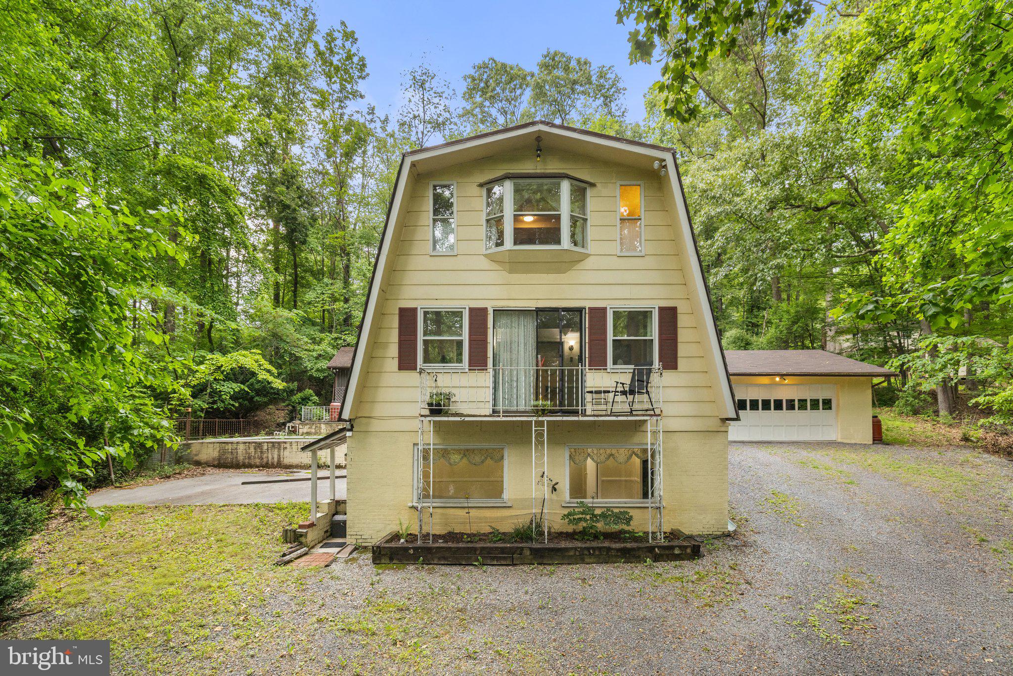 If you are looking for a home with privacy and a peaceful rural feel but only 15 minutes to Winchester then this home is for you! Set in a natural habitat, 102 Duwamish Trail has a vintage feel and could be a weekend getaway or your primary residence away from the city. No HOA!
There is an open feel to the main level which has a versatile floor plan. There is a sunroom, a family room & a kitchen with an island and lots of cabinets open to the dining area. On the front of the home is a living room with a sliding glass door to the balcony!
The upper level has a spacious primary suite with a private bathroom and lots of closet space. There is an additional bedroom and full bath for guests or family.
The basement has a laundry room and a large storage room.
The 2 car garage is attached to the house by a breezeway. It has an auto opener for the door and room for all your tools.
For entertaining or just sitting outside listening to the birds there is a screened pavilion which overlooks an in -ground pool in need of repairs. The inground pool could easily be converted to a Walipini greenhouse!
Comcast xfinity internet is available. The HVAC was replaced 2 years ago. Flooring has been recently replaced as well as the refrigerator.
There is a wood stove if the power goes out. The home is oriented so that it is solar passive.
Shawnee Land is a great neighborhood for walking or bike riding.
This neighborhood is in the Sanitary District with a county fee of $660 annually which includes access to a private beach, walking trails, playgrounds, ponds and lakes are included.
Owner Occupied. Please do not go down the driveway without an approved appointment.
This property may not be suitable for VA or FHA financing. The seller will not make any lender required repairs because the property is being sold “as-is”.