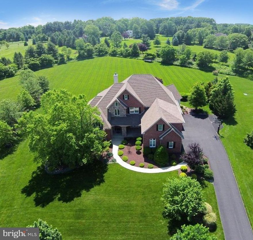 Welcome to this spectacular custom built home in Belamour, one of Upper Makefield's most prestigious and sought after new home communities, located in Washington Crossing. Hand crafted by Chris Pisani Builders, this home and property offers fabulous amenities, great value and the chance to move right in to the community as opposed to waiting 18 months to build from scratch. Featuring a luxurious First Floor Master Suite with rear patio access and his and hers walk in closets, the spacious open layout offers 5/6 bedrooms, 5 full and 1 half baths and three full floors of beautifully finished space on a gorgeous and private 1.58 acre lot. Enter to the two story foyer, with gleaming hardwoods, formal dining room to the right, office / library to the left. The living room features an impressive floor to ceiling stone fireplace and walls of windows. The gourmet kitchen features a giant island with seating for 6, custom cabinetry, stainless steel appliances. The very cozy family room is adjacent, with cathedral ceiling. A generously sized laundry room, convenient mud room, powder room complete the main floor. The upper level boasts 4 large bright and airy bedrooms; 2 of which are en-suite; and 2 share a Jack and Jill bath. The finished, walk-out lower level offers premium space for entertaining, working out and offers a flex bonus room for a 6th bedroom with full bath and steam shower. The rear paver patio has open views and this level lot will accommodate a pool or tennis court. Offered for the first time by the original owners, this home has been lovingly maintained and upgraded. Generous landscaping, Back-up generator, surround sound speakers, three car garage and more. Just minutes from Newtown, New Hope, New Jersey Bridge and I -95 and located in the Council Rock School District.