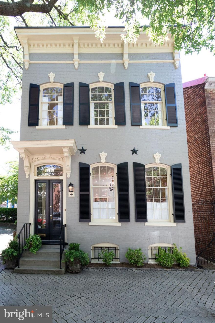 212 S. Royal Street is an exquisite historic home, built in 1800, that has been fully remodeled and offers modern conveniences combined with historic charm. The home is sited on Lot #67, one of Alexandria's original 84 numbered lots laid out by surveyor John West, Jr. with the assistance of 17-year-old George Washington. Enter through a vestibule into a light and bright entry hall with a large cased opening into the living room which features large windows, high ceilings and a gas fireplace. The formal dining room includes a second fireplace and custom built-in shelving. A family room with vaulted ceiling and floor to ceiling windows overlooks the garden and is adjacent to the kitchen. The custom kitchen features SubZero, Bosch and Miele appliances, abundant cabinet storage and counter space, instant hot faucet and wine refrigerator. The upper level features 3 bedrooms plus a den or office off the master bedroom, 3 full baths, conveniently located laundry and plentiful closet storage. The delightful brick-walled garden's lush plantings make this a spacious and private oasis in the heart of Old Town. Unbeatable location, just 1 block to shops and restaurants on King Street, 3 blocks to the Potomac River, close to Metro and an easy commute to DC and Amazon headquarters.Link to video tour: http://homes.btwimages.com/212sroyalst