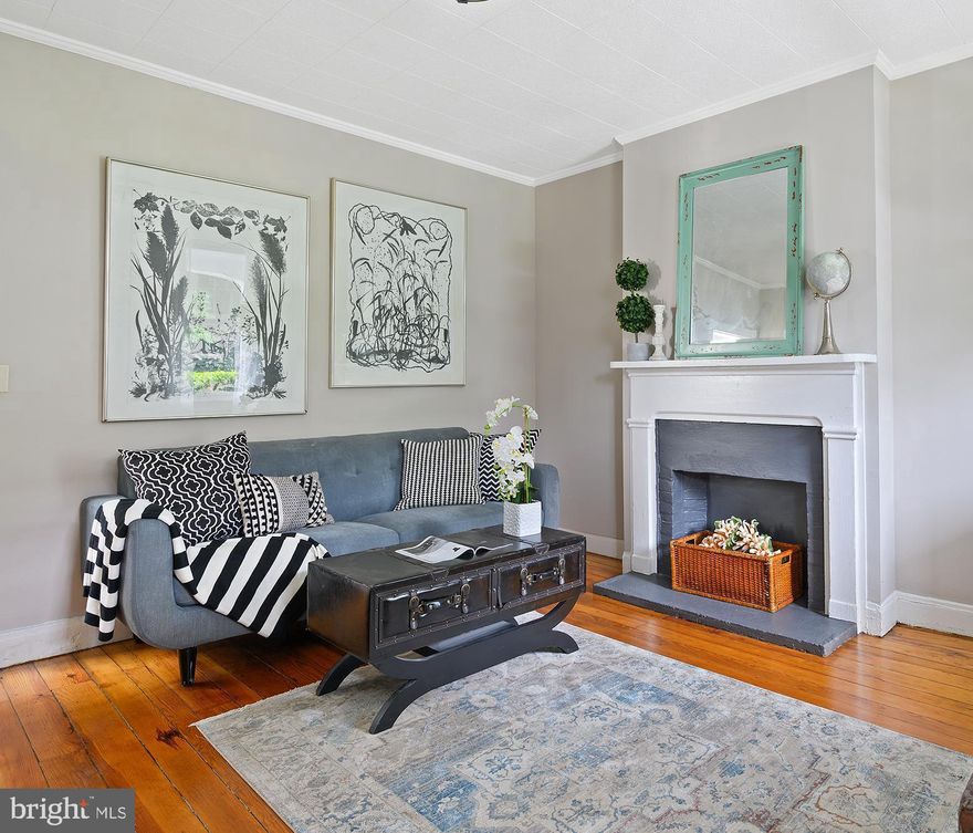 Excellent new price! Now offering credit for a preferred lender 2/1 Buy-Down. The 2-1 temporary buy-down will reduce buyer's interest rate 2% in the first year and 1% in the second year. Own a piece of historic Hampden. Happy, light-filled 1870 semi-detached. Huge backyard—grow vegetables in the city! Two-story garage outbuilding—renovated (non-parking) garage with electric and separate meter is an ideal rental income opportunity. Below is an open space perfect for gardeners, ceramists, painters. And now with a one-point loan reduction with the participating lender Renovated, but still showing character and charm. 1,764 spacious square feet of living space—plenty of room to spread out for all your interests and hobbies. So many creative possibilities in this property! Enjoy as is, or make small changes to make it your own. Great location near the Avenue, Woodbury, bike to MICA, JHU.