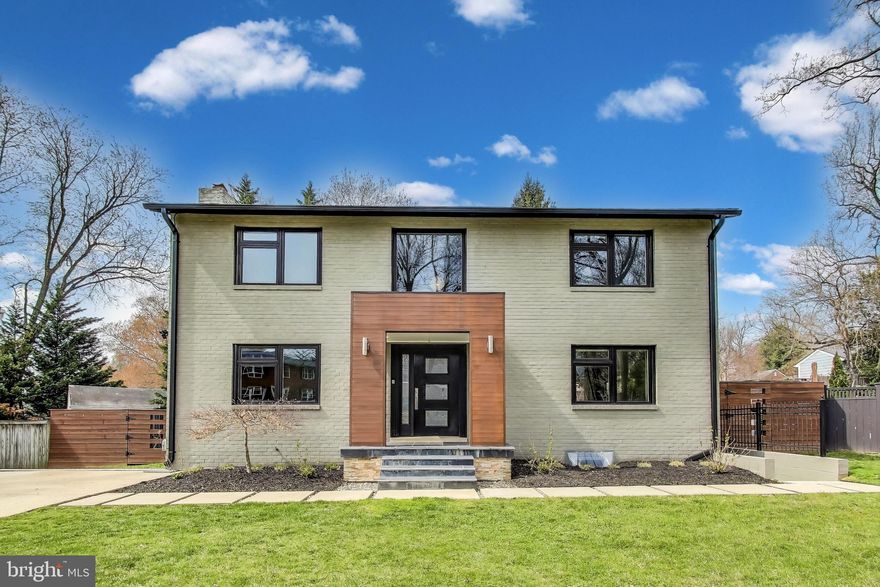 The ultimate transformation from brick colonial into a modern masterpiece is now available in Kensington for a discerning buyer! Gutted to the studs on the interior, every detail of this masterpiece was meticulously designed and planned during the renovation process. Enter into a completely open floor plan on the main level, highlighted by the centrally located kitchen and double height foyer with a custom lofted staircase, a true work of art. The kitchen is outfitted with custom cabinetry, Krion by Porcelanosa counter tops with a waterfall design, and stainless steel appliances. The spaces around the kitchen are perfect for entertaining - all seamlessly open and connected to each other but with identified purpose. The dining and living room spaces are comfortable and integrated to the open plan. Another sitting nook or work from home space with a gas fireplace offers a cozy retreat on the first floor. The designed powder room can't be missed. Spill into the back yard with multiple areas to entertain, custom outdoor kitchen with built in grill and mini fridge, and horizontal slat fence elevating the sense of modern in and outside of the home. 

Traversign up the floating staircase to a luxurious master suite with a fully built out walk-in closet, custom TV mantel piece, and Pocelanosa finishes throughout the master bath with a walk-in glass door shower. Down the hall are two more spacious bedrooms with custom closets and another Porcelanosa finished hall bath with tub. 

The basement continues the modern theme with ceramic tile floors, a built-in custom bar with beer/wine/drink fridge, and custom cabinets, and a wall integrated gas fireplace to truly warm the space. A guest room with attached full bath, again designed Porcelanosa finishes, may leave your guest wanting to move in! The laundry room is spacious with a high end washer and dryer. Ample storage is available in the unfinished portion of the basement and can also be used as an at home gym. 

All of this available in blooming Kensington - close to restaurants, grocery, commuter access to all major routes of travel, and the home sits quaintly on a cul-de-sac. This is your opportunity to own the fruits of another homeowners' meticulous attention to detail and design!