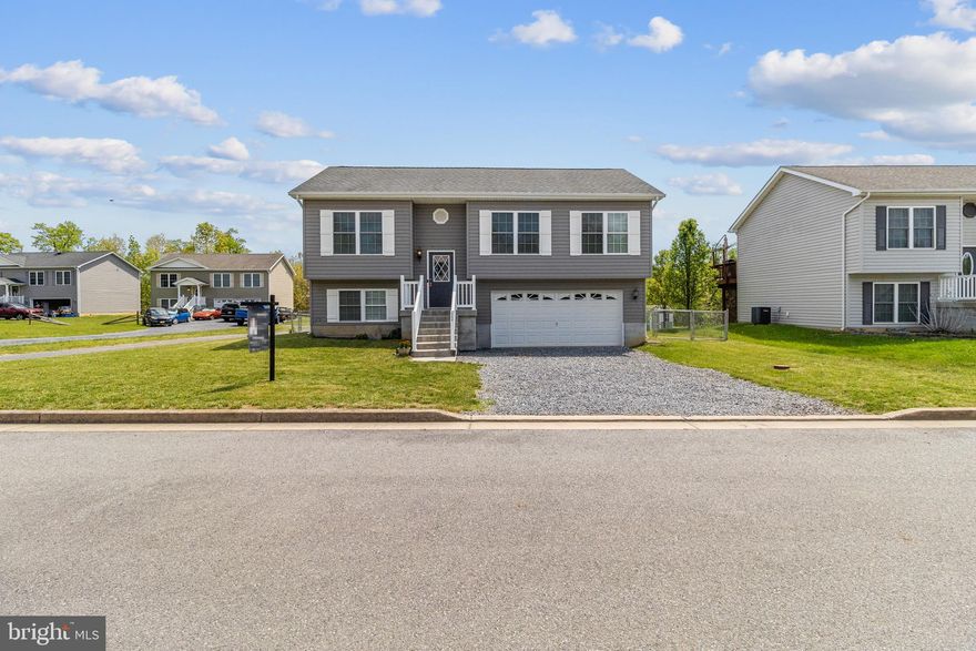 This stunning single-family property in Bunker Hill, WV offers 4 bedrooms and 3 bathrooms, providing ample space for comfortable living. This bi-level,  private family home is perfect for a multi-family. The home is located on a quiet cul-de-sac just minutes from I-81, exit 5, just minutes from Amazon and P&G!!! Providing accessibility to major highways puts almost every location like Hagerstown, Martinsburg, Charles Town, Winchester, Virginia, Pennsylvania, and Maryland just minutes away. This  4 bedroom, 3 full bathroom home features a SECOND KITCHEN and a full bathroom and can function as an in-law suite. Newly renovated with FRESH PAINT, NEW CARPET, and NEW LVP flooring as well as central air conditioning, NEW STAINLESS STEEL APPLIANCES, built-in microwave, washer/dryer, and new kitchen cabinetry with granite countertops.  Fully fenced backyard with back to trees and a picturesque pond. Two-car garage parking, two uncovered parking spaces in the driveway, and street parking are available.