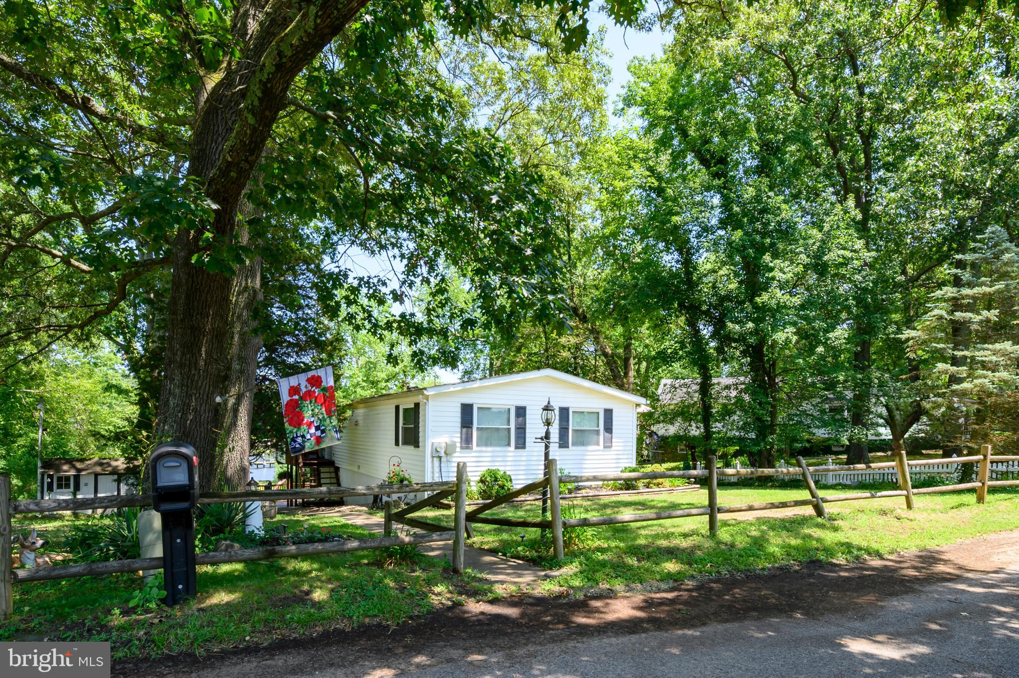 Welcome to waterfront living on the Magothy in Boulevard Park Pasadena! This includes both 443 and 441 New York Ave, over half an acre. 441 New York was perc'd April of 2024 for up to a 750sqft dwelling. Upper level which includes 3 bed and 1 full bath recently updated with new floor/carpet, windows, paint, and interior doors. Lower level has potential 4th bedroom or office as well as another full bath. The basement opens up to the screened in porch, followed by the back deck overlooking views of Grays Creek. The community of Boulevard Park also offers a public beach, boat ramp, and picnic area. Atlantic Marina on the Magothy also steps away.