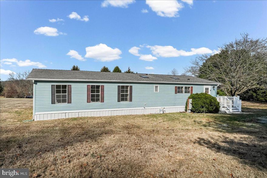 Welcome to this beautifully renovated 3-bedroom, 2-full-bath double wide mobile home offering modern comfort in a peaceful, private setting. This move-in-ready residence has been thoughtfully updated throughout, featuring stylish finishes and contemporary upgrades that make it feel fresh and inviting from the moment you step inside. Recent improvements include a newer roof, updated bathrooms, new flooring, fresh paint, and upgraded plumbing, giving buyers peace of mind and a truly turnkey experience.

Situated within a quiet community of only three homes, this property offers exceptional privacy and tranquility with no close neighboring houses. The home sits on a spacious 1.7-acre yard area available for your use, providing plenty of room to relax, entertain, or simply enjoy the surrounding natural beauty.

Start your mornings with coffee on the charming front porch or unwind in the evening on the deck while taking in the scenic views and peaceful atmosphere. The lot rent is $800 per month and conveniently includes water and sewer, making ownership both simple and affordable. This home also will come with a home warranty for the new owner for added peace of mind.

If you’re looking for a beautifully updated home that combines modern living with quiet surroundings and open outdoor space, this property is a must-see. Schedule your tour today. Financing available.