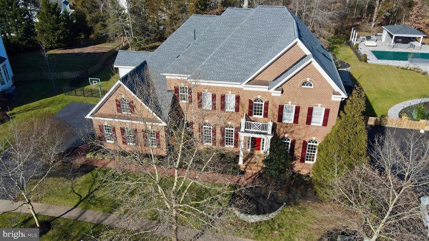 Back on market and open house Sunday June 9th 2-4 PM!**New price and sellers are finishing a beautiful kitchen and butler's pantry  update including all new stainless appliances.    Don't miss the opportunity to own this  exquisite home built by Basheer and Edgemore,  a premier regional builder. The Davenport model is revered for its thoughtful and very livable use of space    Located in Lansdowne's  West Goose Creek, section, this  home boasts a two story foyer and ten foot ceilings .  Potential for a main level bedroom/bath suite ( see floor plans in documents.) The upper level features a huge primary suite with a sitting room. Primary bath holds a soaking tub, new frameless shower and two separate water closets, as well as loads of storage. In addition, there are four large ensuite bedrooms with huge closets and a newly renovated laundry room with storage cabinets. Sip your morning coffee by either of the two main level fireplaces, in the kitchen "hearth room" or the family room. Large, open kitchen with cherry cabinets, granite and a new gas cooktop, as well as a bulter's pantry and huge walk-in pantry for additional storage.  Entertain on the huge covered porch overlooking a flat, fenced, over half acre lot backing to trees. This lot has ample space to accomodate a pool or sport court, a rarety in Lansdowne. The thoughtfully finished basement features an ensuite bedroom with window egress as well as a powder room for guests. A huge recreation room with fireplace, media room, gym and craft room are also located in the basement. This beautiful home has been freshly painted and has new carpet and newly refinished cherry floors. New roof 2021. Neighborhood amenities include access to the Potomac Club with its indoor and outdoor pools, gym and meeting space, as well as an additional outdoor pool, tennis courts and walking trails. Easy access to shopping and dining at Lansdowne Town Center,  downtown Leesburg and  One Loudoun.