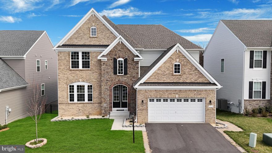 Coming soon—an opportunity to secure one of Tallyn Ridge’s most commanding residences, where design, scale, and setting converge to create a home that is as rare as it is unforgettable.

5719 Hawk Ridge Road introduces one of the most distinguished offerings within Frederick’s highly sought-after Tallyn Ridge—an architectural statement by Drees Homes showcasing the coveted Rowan model, the largest and most expansive design available in the community. Positioned on a premier lot backing to a serene forest conservation, this residence delivers a rare blend of scale, privacy, and elevated design—further distinguished as the only model featuring a fully integrated sunroom extension that expands both the above-grade living space and the walk-out lower level footprint. A striking brick-front exterior and stately portico entry set the tone for what unfolds within. Upon arrival, you are welcomed into a home defined by graceful curved archways, soaring ceilings, and sun-drenched interiors that create an immediate sense of openness and refinement. The main level is thoughtfully designed for both everyday living and elevated entertaining, anchored by a true gourmet kitchen featuring Snow White cabinetry, a gas-powered cooktop, and a full suite of stainless steel appliances—seamlessly flowing into an expansive family room. Just beyond, the dramatic bumped-out sunroom—framed with a charming barn door entry—offers an extraordinary extension of living space, rarely found and impossible to replicate, enhancing both the main and lower levels.
Upstairs, four generously sized bedrooms and three full bathrooms provide a private retreat for every member of the household. The owner’s suite is a sanctuary of its own, complete with high ceilings, abundant natural light, and a spa-inspired ensuite bath featuring frameless glass shower doors, a deep soaking tub, and dual vanities adorned with stone countertops—designed to evoke a sense of quiet luxury. The walk-out lower level continues the home’s impressive scale, offering a fully finished open-concept basement with an additional bedroom and full bath—ideal for guests, multigenerational living, or a private suite. With a full bathroom on every level and a total of six bedrooms and five full baths, the home delivers both flexibility and function at an uncompromising level. Beyond the home itself, Tallyn Ridge offers a lifestyle enriched by community amenities including scenic trails, clubhouse, pool, and gathering spaces—all while being strategically positioned with seamless access to major commuter routes, including I-70 and Route 15, placing you within close reach of downtown Frederick’s vibrant shops, dining, and cultural attractions, as well as convenient connectivity to Washington, D.C., and surrounding employment hubs.