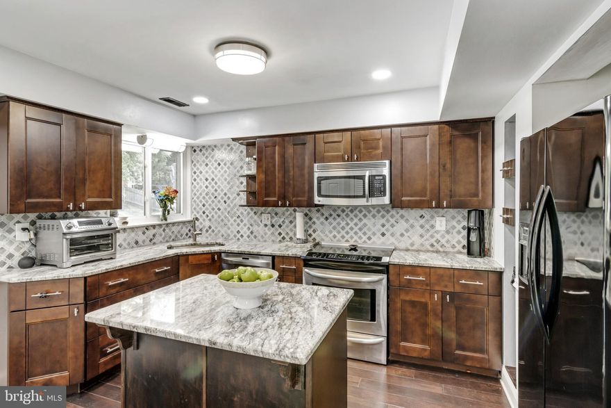 Located in the Patterson Mill school district, this home has been totally renovated since 2019!  New kitchen with island, cabinets, granite countertops, walk-in pantry, and appliances.  All baths remodeled with tile floors, granite vanity tops (dual sinks in both full baths), and beautiful tile bath/shower surround!.  Hardwood floors throughout the first floor, plus stairs, and hallway.  Many rooms nicely appointed with moldings.  You'll enjoy the outdoors on your deck with pergola, or on the spacious patio, or sitting around the firepit!  Move right in!