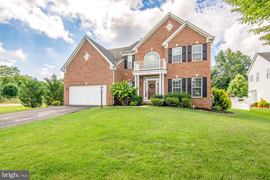 Beautiful Brick front Colonial with over 3500 sq ft on three finished levels. Boasting a maintenance-free Trex deck and Paver Patio with built-in firepit. All floors on main level have been updated with laminate wood and fresh paint throughout the home. Kitchen is open to a sunroom and lovely family room with stone gas fireplace and custom coiffured ceiling. Lower level has a finished additional family room with walk-out and walnut bar that conveys. Plenty of unfinished sq ft to make your own or use as storage space. Upper level boasts a Master Suite with french doors, tray ceiling, his & her walk-in closets. Master bathe features soaking jetted tub and separate shower and  dual vanity with Granite. Convenient location to APG, I95 and Amtrak and just minutes to the Chesapeake Bay