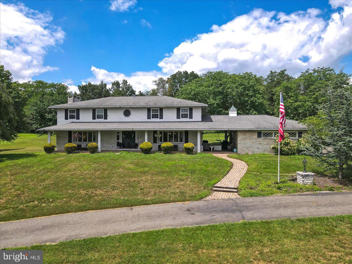 OPEN HOUSE CANCELLED. Nestled on just under 4 acres in the picturesque Mahoning Valley, this spacious 3,600 sq ft home offers a perfect blend of elegance, comfort, and functionality. Featuring 5 bedrooms and 4 full baths, the home boasts an open floor plan that flows seamlessly through the main living areas. The heart of the home is the expansive kitchen, complete with a center island, custom-built pantry, and an abundance of cabinetry—perfect for everyday living and entertaining alike. A formal foyer welcomes guests through double doors, showcasing a grand helical staircase. The large living room offers sweeping views of the valley, open to the family room with fireplace. A guest bedroom, full bath, and a spacious laundry room round out the first floor. Upstairs, you'll find 4 generous bedrooms, including a luxurious main suite that feels like a private retreat, complete with a nursery or office, a bathroom with oversized shower, and four closets—this suite defines comfort and privacy. The finished basement adds even more value, featuring a second family room perfect for movie nights or playtime, plus two additional rooms currently used as bedrooms, ideal for guests, home offices, or hobby space. Additional highlights include central air, a breezeway to the garage, a long winding macadam driveway, and an attached 2-car garage. With timeless charm and modern updates, this property offers space to grow in a truly beautiful setting.