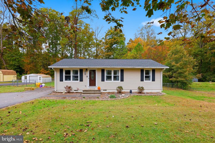 Nestled in the charming Deerfield community, this delightful ranch-style home offers a perfect blend of comfort and functionality. With almost 1,000 sq. ft. of thoughtfully designed living space, this residence features two inviting bedrooms and a full bathroom, ideal for relaxation and rejuvenation. As well as a separate office/play room off the kitchen. Step inside to discover a warm atmosphere enhanced by crown moldings and beautiful wood floors. The traditional floor plan includes a cozy dining area and a bright breakfast nook, perfect for enjoying morning coffee. The kitchen is equipped with stainless steel appliances, including a built-in microwave and electric oven, making meal prep a breeze. Natural light pours in through double-hung windows, creating a cheerful ambiance throughout. The main floor laundry hookups add convenience to your daily routine, while the attic provides additional storage options. Outside, the almost 1/2 acre lot backs to serene trees, offering a peaceful retreat. Enjoy evenings on the deck or relax on the porch, surrounded by nature. The property also features secure storage options with a shed, perfect for gardening tools or outdoor equipment. Rear yard is completely fenced. Parking is a breeze with an asphalt driveway, ensuring easy access, Ring doorbell conveys with home. HVAC was replaced in 2025 upgraded with an air scrubber! This home is not just a place to live; it’s a sanctuary where memories are made. Experience the warmth and charm of this inviting property, ready to welcome you home.