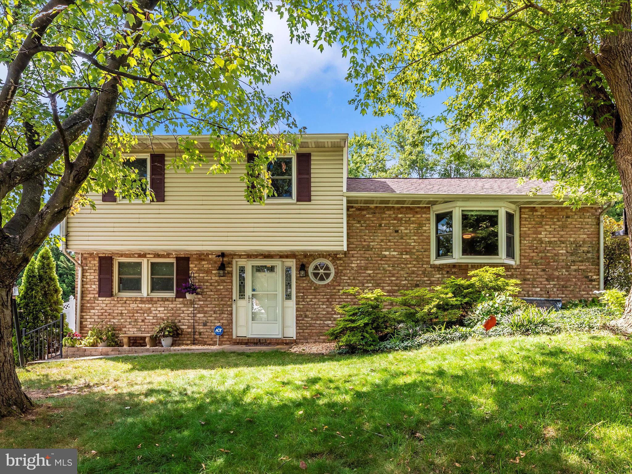Charming 4 level Split Home has been loved and updated by the Owners. Great location, convenient for commuting, but quiet and so tranquil with a large privacy fenced yard. Gardeners, and most everyone, will delight in the large yard with the privacy fencing! The owners have added various native perennials too. The owners love the extensive decking and patio! Enter on the main level with a bedroom and family room area that walks out to the patio. NOTE: The Owners consulted with a Plumber who confirmed that the plumbing is on the other side of the Built-in's on the main level family room. Definitely the place to add a full bath and create a MAIN LEVEL Primary Bedroom! The lower level, has full size windows and offers good light. There is an attached walk-in closet so this is considered bedroom 5. Presently used as an office space. An older in-law kitchen is on this level too. Lots of possibilities! The main level living room and attached dining room feature refinished hardwood flooring. Moving on to the kitchen -- eat-in style and BIG with lots of cabinetry and center island with downdraft cooktop.. Walk-out to the deck from the kitchen for the grillers and outdoor dining! The primary bedroom and 2 other bedrooms are located on the upper level. The owners added a heat pump that serve the kitchen/living/dining room level and bedrooms on the upper 2 level as well. The split system serves the main level and the lowest level has electric baseboard heat. This home feels MUCH larger than the assessed record and shows very well! UPDATES: New Heat Pump and ductwork Main living Area (Upper 1) and Bedroom Level (Upper 2) - 2021. Kitchen: Replaced Dishwasher - 2022. New Carpet in Main and Lower 1 - 2022. Refinished Hardwood Floors in Living Room and Dining Area (Upper 1) - 2023. Swingset (conveys) - 2021. Washer and Dryer- 2023. New Roof with lifetime transferable warranty - 2023. Water heater - 2023. Privacy Fence (Vinyl) - 2024. Great home - no town taxes, but very close to all you need and want!