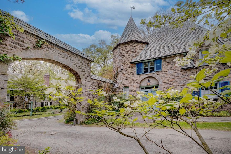 Welcome to 419 Gate Lane, a remarkable 2 ½-story stone gatehouse nestled within the prestigious French Village Historic District in West Mount Airy. Commissioned by George Woodward and designed by Robert R McGoodwin, this home is a true architectural gem, offering a unique blend of timeless elegance and modern comfort.
Historic Charm with Modern Upgrades - Built between 1924 and 1936, the French Village comprises 24 stone houses designed in the French Norman Revival Style. 419 Gate Lane, with its steep bell-cast hipped roof, gable, and eyebrow dormer windows, is a standout example of this exquisite craftsmanship. This home received historic designation in 2021, ensuring its place in history for generations to come.
Meticulously Maintained and Upgraded - This 3-bedroom, 4.5-bathroom home has been lovingly maintained and benefits from significant system upgrades, including a newer boiler, high-velocity central air, updated electrical work, ceiling fans, and recessed lighting, and beautiful wood floors throughout.
Seamless Indoor-Outdoor Living - The living room features a wood-burning fireplace, built-in bookshelves, crown molding, and recessed lighting, creating a warm and inviting atmosphere. Updated French doors in the living room, dining room, and sunporch open to a magnificent full-length Trex deck, seamlessly blending indoor and outdoor living spaces.
Gourmet Kitchen and Elegant Dining - The stunning kitchen renovation boasts two sinks, stainless steel appliances, quartzite countertops, gas cooking, and custom cabinets made by Pappajohn Woodworking, providing ample storage space. The kitchen's open design flows into the dining room, which features large openings to the living room and sunporch, creating an ideal space for entertainment.
Luxurious Retreat - Upstairs, the second floor offers a spacious primary suite with ample closet space and a private bathroom with a stall shower. A second bedroom, hall bath, and laundry closet complete the second floor. The top floor features a third bedroom and full bath, perfect for additional family members, guests, or a home office.
Versatile Lower Level - The lower level, accessed through the kitchen, features a finished bonus room with a fourth full bathroom, offering endless possibilities for use, such as an in-law or au pair suite, office, or recreational space.
Prime Location - Nestled in a serene setting, this home is surrounded by mature gardens and offers direct access to walking trails of Cresheim Creek and the Wissahickon Valley. It is conveniently located blocks from the Allens Lane Art Center, Carpenter’s Woods, and the Allen Lane Train station. Enjoy easy access to the shops and dining in Chestnut Hill, downtown Mount Airy, and Mount Airy Village, making this property an ideal blend of historic charm and modern convenience.