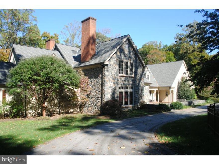 An elegant 5.9 acre estate in a peaceful country setting. The fully custom stone dwelling was built in 1997-a Dewson masterpiece that is the perfect space for entertaining and creating your private retreat. Lovely brick herringbone terraces for enjoying the outdoor serenity or for casual dinner parties. The first floor main bedroom suite has a private terrace, private bath with dressing room. Second floor has three bedrooms with an additional bedroom suite and an exercise room. There are six fireplaces, handsome built ins including a private bar off the living room, random width white oak floors and extensive moldings throughout. Gourmet kitchen, library, attached heated  garage, lower-level with outside entrance and fireplace and an enchanted potting alcove. Geothermal heat, generator.