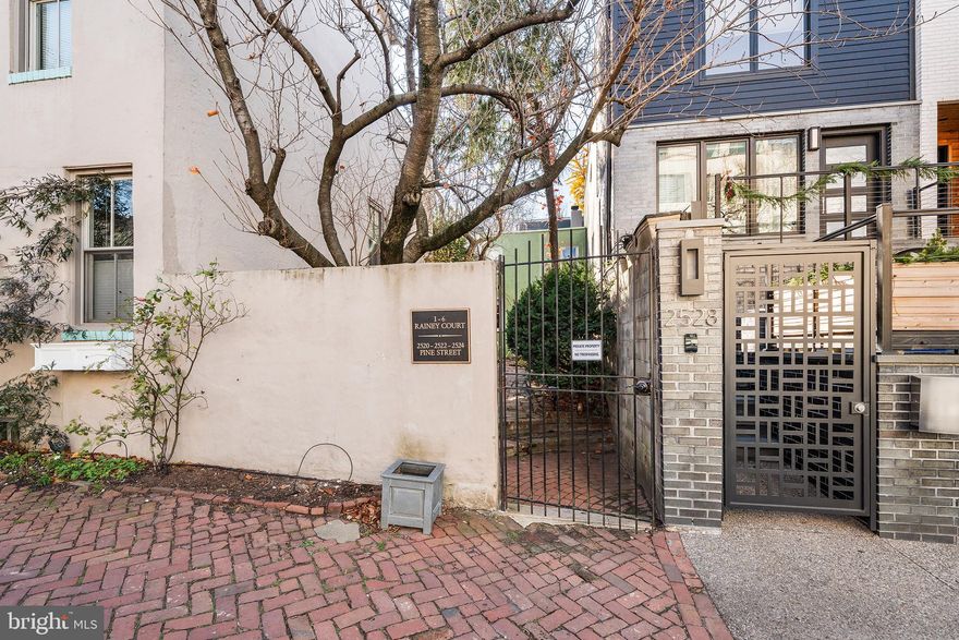 Nestled in the heart of prestigious Fitler Square, in a semi-private gated and verdant courtyard, this exquisite 1850s townhome seamlessly blends historic charm with modern elegance. With two spacious bedrooms and two full bathrooms, this residence offers a perfect sanctuary for those who appreciate city living with a healthy dose of serenity. As you approach the entrance, you are greeted by a warm and inviting atmosphere that exudes comfort and sophistication. The well-maintained masonry exterior hints at the rich history of the home, while the interior boasts a layout that maximizes both space and functionality. The side-by-side design allows for an abundance of natural light to flow through, creating a bright and airy ambiance throughout. The heart of the home features a thoughtfully designed kitchen, perfect for culinary enthusiasts where it is easy to envision a space to create gourmet meals and memories. The adjacent living room provides an intimate setting for gatherings, with access to a yard tastefully landscaped with a variety of trees, shrubs and ivies that create a zen vibe rarely found in a City home this size. Retreating to the primary suite offers a true haven of relaxation, complete with ample closet space and an en-suite bathroom. The second bedroom is equally inviting, ideal for children, guests or as a personal office space and is also accompanied by its own full bath and access to a Juliet balcony. The full basement offers additional storage and laundry facilities, ensuring that every inch of this home is utilized efficiently. Step outside to discover the charm of Fitler Square, where tree-lined streets and vibrant community life await - from the weekly farmer's market to the Schuylkill Banks boardwalk and trails, and the Markward courts. Enjoy leisurely strolls to to the numerous boutique shops, and gourmet dining options that define this exclusive neighborhood. Minutes from Penn, CHOP and the Expressway, this location is a commuter's dream. This property is not just a home; it's a lifestyle. Experience the perfect blend of historic elegance and modern comfort in a location that embodies the essence of city living. Don't miss the opportunity to make this enchanting townhouse your own, where every day feels like a retreat.