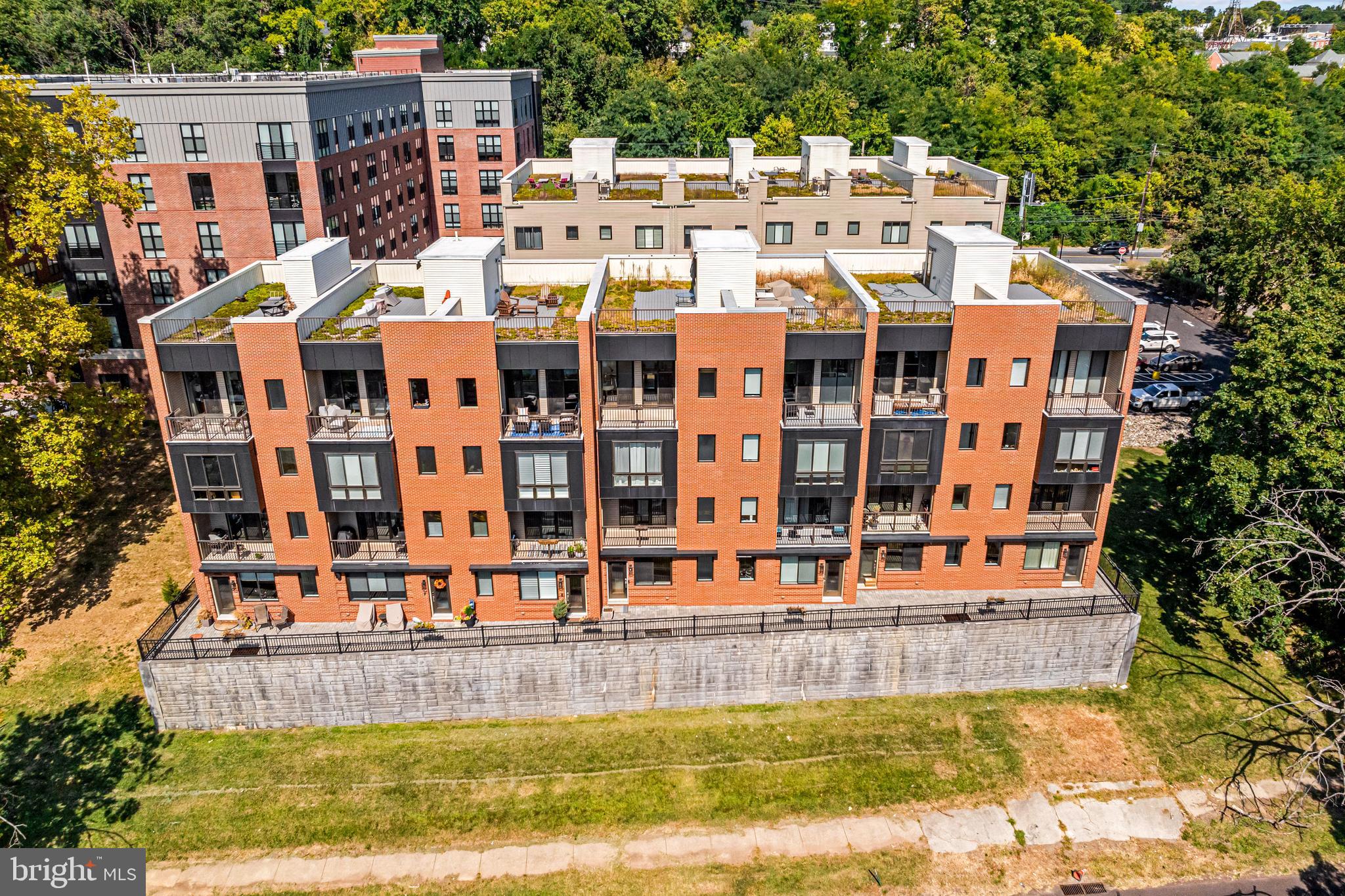 Welcome to your dream home perched above the Schuylkill River in the highly sought-after East Falls neighborhood, where nature and luxury blend seamlessly. This magnificent 3-bedroom, 3.5-bathroom residence at The Overlook offers breathtaking river views from every level. Upon entering, you're greeted by an open-concept living space bathed in natural light, with soaring ceilings, floor-to-ceiling windows, and high-end finishes throughout, creating a timeless, sophisticated atmosphere. The gourmet kitchen, designed for the culinary enthusiast, features state-of-the-art appliances, sleek countertops, and an abundance of space for entertaining. The river views from every angle beckon you to relax and enjoy the peaceful surroundings. Beautiful hardwood floors extend throughout the home, complementing the chef's kitchen, which boasts custom cabinetry, a chic backsplash, stainless steel appliances, and designer pendant lighting. Step out onto the front balcony or let the sunlight pour in through the expansive windows in the living room, creating the perfect ambiance for both relaxation and entertaining. Both secondary bedrooms are en suite, offering privacy and comfort for guests, while a spacious laundry room adds a touch of convenience. On the master level, a true sanctuary awaits with a spacious bedroom, a spa-like bathroom with double sinks, a luxurious glass-enclosed shower, and a cozy sitting room. Double sliding doors lead to a private balcony where you can take in the tranquil views. The crown jewel of this home is the rooftop deck, where you can savor panoramic views of the Schuylkill River and the historic East Falls skyline. The attached garage and private elevator make this home as practical as it is luxurious. As a resident of The Overlook, you'll enjoy exclusive access to the incredible amenities at The Anchorage on Kelly, including coworking spaces with private meeting rooms, a resident lounge with a full kitchen, a yoga studio, a state-of-the-art fitness center, a pet spa, and a sun deck terrace with breathtaking views. With easy access to major highways, City Avenue, Kelly Drive, Center City, and King of Prussia, and five years remaining on the tax abatement, this home offers a rare combination of luxury, convenience, and tranquility. Experience unparalleled living in this million-dollar masterpiece, where every detail has been meticulously designed for the most discerning buyer. Welcome to the pinnacle of modern elegance, where every moment feels extraordinary.