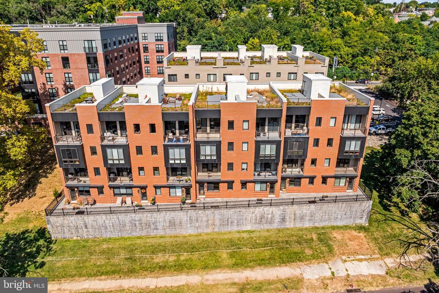 Welcome to your dream home perched above the Schuylkill River in the highly sought-after East Falls neighborhood, where nature and luxury blend seamlessly. This magnificent 3-bedroom, 3.5-bathroom residence at The Overlook offers breathtaking river views from every level. Upon entering, you're greeted by an open-concept living space bathed in natural light, with soaring ceilings, floor-to-ceiling windows, and high-end finishes throughout, creating a timeless, sophisticated atmosphere. The gourmet kitchen, designed for the culinary enthusiast, features state-of-the-art appliances, sleek countertops, and an abundance of space for entertaining. The river views from every angle beckon you to relax and enjoy the peaceful surroundings. Beautiful hardwood floors extend throughout the home, complementing the chef's kitchen, which boasts custom cabinetry, a chic backsplash, stainless steel appliances, and designer pendant lighting. Step out onto the front balcony or let the sunlight pour in through the expansive windows in the living room, creating the perfect ambiance for both relaxation and entertaining. Both secondary bedrooms are en suite, offering privacy and comfort for guests, while a spacious laundry room adds a touch of convenience. On the master level, a true sanctuary awaits with a spacious bedroom, a spa-like bathroom with double sinks, a luxurious glass-enclosed shower, and a cozy sitting room. Double sliding doors lead to a private balcony where you can take in the tranquil views. The crown jewel of this home is the rooftop deck, where you can savor panoramic views of the Schuylkill River and the historic East Falls skyline. The attached garage and private elevator make this home as practical as it is luxurious. As a resident of The Overlook, you'll enjoy exclusive access to the incredible amenities at The Anchorage on Kelly, including coworking spaces with private meeting rooms, a resident lounge with a full kitchen, a yoga studio, a state-of-the-art fitness center, a pet spa, and a sun deck terrace with breathtaking views. With easy access to major highways, City Avenue, Kelly Drive, Center City, and King of Prussia, and five years remaining on the tax abatement, this home offers a rare combination of luxury, convenience, and tranquility. Experience unparalleled living in this million-dollar masterpiece, where every detail has been meticulously designed for the most discerning buyer. Welcome to the pinnacle of modern elegance, where every moment feels extraordinary.