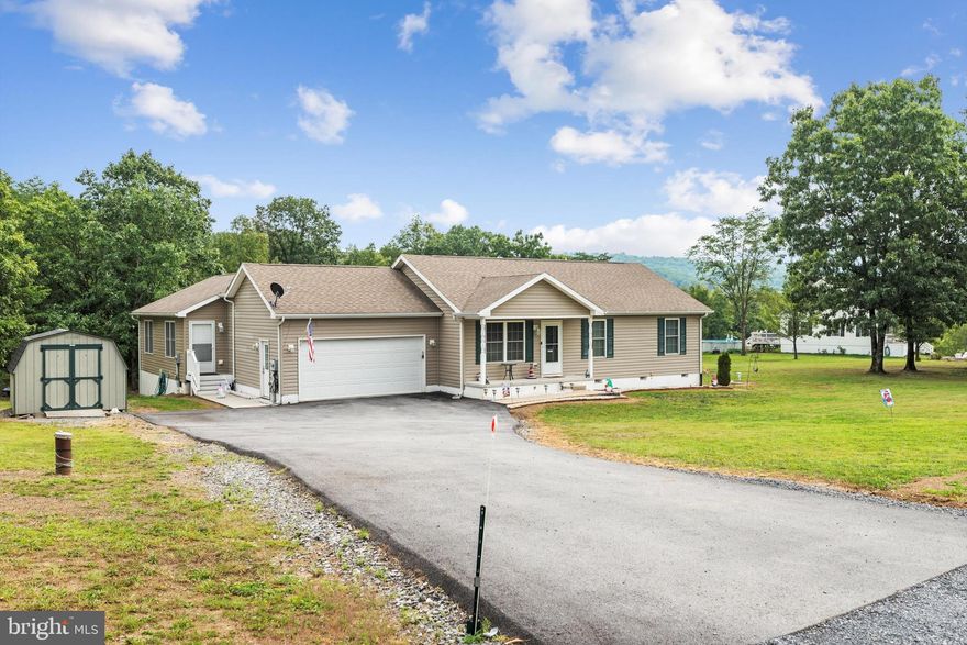 2 SEPARATE LIVING QUARTERS IN THIS ONE-LEVEL RANCHER WITH PARTIAL BASEMENT ON 2.5 ACRES! Almost 2,000 FINISHED SQ FT on main level with main house containing 3 bedrooms/2 baths. In 2015, Sellers added an IN-LAW ADDITION of separate living quarters offering COMPLETE INDEPENDENT LIVING with1 bedroom/fully-functioning eat-in kitchen/living room/full bath/separate laundry and exterior entrance! Both living areas are connected and share TREX deck in rear and 2 car garage. Partial unfinished basement under new addition adding tons of storage room. Shed conveys along with generator, all appliances including 2 sets of washer/dryers and garage freezer. Well-maintained home on 2.5 rolling acres that backs to trees for privacy. If rural living with NO HOA is what you’re looking for, this is it!