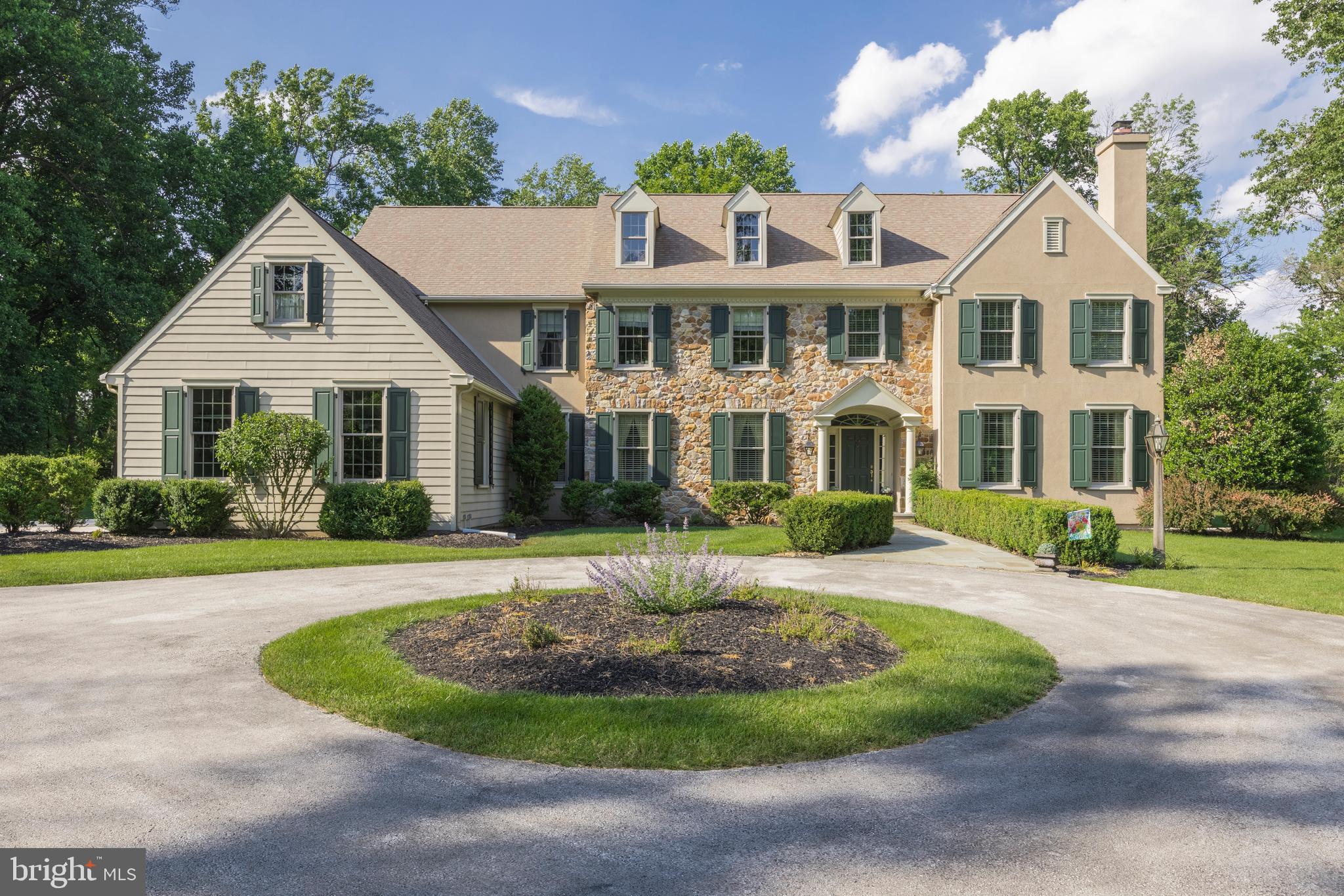 This fabulous Malvern built center hall colonial located in the Briarwood Community (developed by Chip Vaughan and Lee Haller), is the perfect place for entertaining. This exquisite home sits on 5 secluded acres and offers over 6,600 square feet of living space. You will always look forward to coming home to tranquility and privacy, all the while being only minutes from schools, shopping, major commuting routes,etc. Enter into the grand two-story open foyer with unobstructed views of the expansive patio and private rear yard. Entertaining will be a breeze with dinner in the large, formal dining room to your left with an inviting living room to your right, complete with gas fireplace. French doors lead into the office/den with a full wall of windows overlooking the professionally designed rear paver patio with custom stone wall and lush surroundings. The gourmet kitchen is fit for a master chef, with extended island, custom Quality cabinetry, two convection ovens, Thermador 5-burner cook-top, plus microwave and warming drawer. The adjoining light and bright morning room with tray ceiling walks out onto the patio. Adjacent to the kitchen is the sun-filled family room with gas fireplace, semi-vaulted ceiling and a wall of windows. Located behind the FR is the mudroom which accesses the laundry room, informal powder room, three car garage, auxiliary entrance and the rear staircase leading to the upper level. Second floor includes - 5 bedrooms (primary ensuite, 2nd and 3rd bedroom with a jack-and-jill bath, as well as the 4th and 5th bedrooms sharing a jack-and- jill bath). Both sets of bathrooms have separate shower/toilet areas and double sinks. The expanded primary bedroom includes a full sitting room, customized walk in closet, open cave limestone shower, jetted soaking tub, two separate Quality vanities and private water closet. The lower level offers a beautiful custom stone fireplace, recreation and bar area, wine closet, exercise room, full bathroom plus a large unfinished area great for storage. Additional amenities include site-finished hardwood floors, stunning mill-work, newer Anderson vinyl clad windows, a whole house generator, invisible fence, newer HVAC (2020) and hot water heater (2016). Also, during the building process the sellers expanded the right side of the home by 3 feet, which makes for a larger FLR, Office, MBR and closet area. House has had a full stucco remediation. Don't miss out on this fabulous opportunity....welcome home!