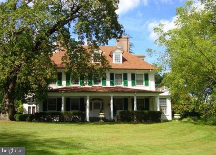 This 7 bedroom, 6 1/2 bath Manor home with charm & character, is beautifully situated, far from the road, on over 2 +/- landscaped acres. Large rooms & high ceilings, lend this spectacular home to grand entertainment or everyday family living. Incredible woodwork, hardwood floors, updated systems, granite kitchen with commercial appliances & French doors to deck overlooking wisteria covered, columned pergola & greenhouse. Move in condition--elegance in a convenient location! There is a 3 car detached oversized garage with loft. In addition, there is a 3 bedroom guest house/apartment with separate entrance & 1 car attached garage. This fine home is conveniently located just minutes to shoppes, train & the famed "Merion Golf Course"!