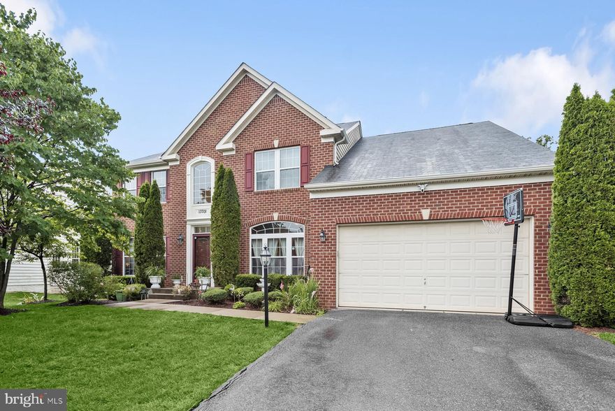 Welcome to this gorgeous home that is pride of the neighborhood! This renovated home provides ample space for family living and entertaining. It features high ceilings, large windows, a finished walk-out basement with a second kitchen, sunroom and deck off the main level, and an open floor plan suitable for modern living. The 2-story foyer leads to a living room and formal dining room, both with appealing features. The main level, with beautiful floors and fresh paint, is well-lit. The kitchen includes quartz countertops, and an oversized island, stainless-steel appliances, ample cabinetry, and a good-sized pantry. Connecting to the kitchen is a family room with a fireplace and a sunroom that leads to a large trek deck, patio and the private backyard. The main level also includes an office, a powder room, a mudroom with laundry, and access to a two-car garage. Upstairs, four spacious bedrooms and two full baths await. The primary bedroom has a large walk-in closet and a luxurious bathroom with dual vanities, a walk-in shower, and custom tile. The fully finished walk-out lower level offers additional recreation space, a kitchen with granite counters, a bedroom, a bonus room, a full bath, and a storage/utility room. Conveniently located in an exclusive neighborhood – close to stores, restaurants, entertainment and recreation options. Commuters delight - a quick drive to Annapolis, Baltimore, and DC!