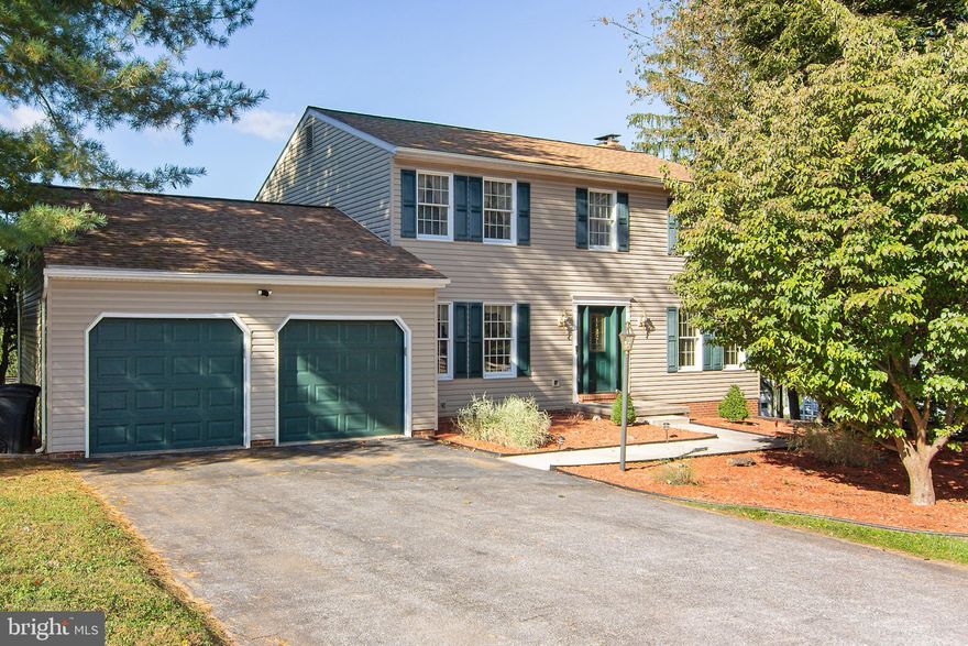 This 4 bedroom 2.5 bath Colonial is situated on a quiet court lot in Wakefield Valley community located minutes south of Westminster. Over 3,100 sq feet of living space with many updates! Main level entry foyer with ceramic tile leading into the breakfast room and kitchen where you'll find updated cabinetry and granite countertops. The b'fast room atrium door opens to the screened in 17 x 14 covered deck with a peaceful view of the rear yard and the pasture behind which is home to several neighboring sheep. Off the kitchen is a hallway where the pantry, updated half bath and laundry room and entrance to the full sized 2 car garage are located. Across from the kitchen is the family room with several windows, brick fireplace and beautiful newer hardwood flooring. There are also formal living and dining rooms with natural newer hardwood floors too.  Traverse up the foyer hardwood stairs to upper level hardwood hallway with 2 linen closets and an updated full hall bath. The Primary bedroom has newer hardwood flooring, walk-in closet and a full bath with updates too.  The lower level features a spacious open recreation room with sliding glass door walk out to the rear of your .69 Acre lot as well as an unimproved  portion of the basement providing plenty of storage room and the utilities. The exterior wasn't overlooked with newer roof, replaced vinyl siding and shutters.  Enjoy the best of both worlds - the country setting with the close conveniences of Westminster just minutes away.