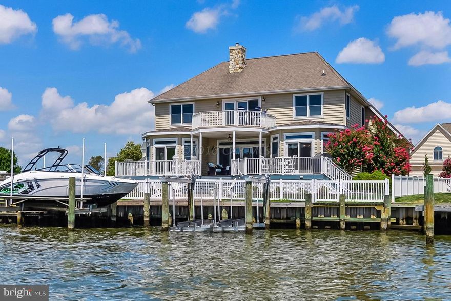 Luxurious coastal bright and airy 6BR/3.5BA direct waterfront home in Heron Harbour, one of the finest communities in Ocean City, is now available for sale. This home is stunning and perfect for lavish gatherings and entertaining.  From the minute you walk in the front door you will fall in love with the open spacious coastal floor plan.  There is a large family room with a gas fireplace for year around enjoyment, and a gourmet kitchen with white cabinets, breakfast bar, Corian counter-tops and double sinks sure to delight the chef in your family.  A large sunny dining area is directly off the kitchen to enjoy a meal and glass of wine with friends.  You will be delighted to find a first floor master bedroom with breathtaking bay views from your bed and large master bath.