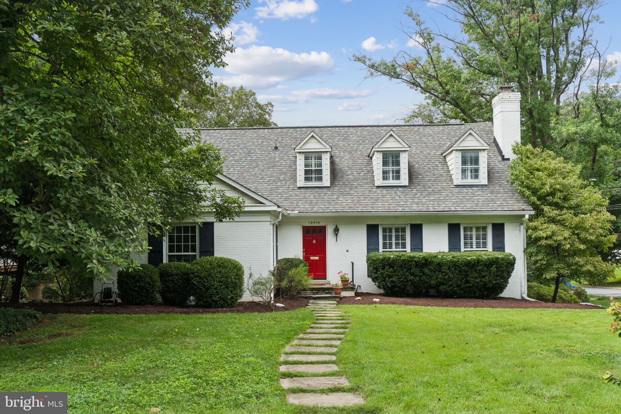 Welcome to 10016 E Bexhill Drive, a beautifully updated home in the heart of Kensington’s sought-after Rock Creek Hills neighborhood. Nestled on a corner lot on a quiet, tree-lined street, this classic brick Colonial offers a perfect blend of timeless charm and modern comfort. Inside, you’ll find spacious and sun-drenched living areas, including a formal living room with a wood-burning fireplace, an elegant dining room with chair rail moldings, and a generous family room ideal for everyday living and entertaining. The renovated kitchen is equipped with stainless steel appliances, quartz countertops, ample cabinetry, and a breakfast nook with an additional fireplace. A private home office is the perfect space to work from home, while a main level bedroom and bathroom offers the ideal space to host guests.
Upstairs you will find three bedrooms and two bathrooms including the relaxing primary suite complete with a beautifully updated en-suite bath and generous closet space.The finished walk-out lower level offers a spacious recreation room, an additional bedroom, full bath, access to the attached garage, and plenty of storage. Step outside to enjoy a lush, landscaped yard with a screened-in patio perfect for summer gatherings, play, or quiet relaxation. Additional highlights include hardwood flooring, recessed lighting, crown molding, an attached two-car garage, and thoughtful upgrades throughout.
Rock Creek Hills offers the perfect blend of peaceful, tree-lined living and unparalleled convenience. Nestled just minutes from downtown Bethesda and Washington, D.C., this established Kensington neighborhood is prized for its spacious homes, large lots, and strong sense of community. Residents enjoy direct access to Rock Creek Park’s trails and green space, top-rated public and private schools, and a close-knit, walkable atmosphere that feels worlds away from the bustle—yet close to everything. Experience timeless architecture, community charm, and a prime location that perfectly balances nature and city convenience.