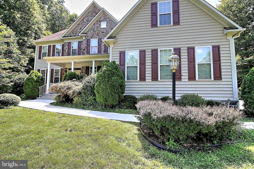 HUGE 6 bedroom, 5 bath, 3 car garage estate home sited on a private wooded 1.3 acre lot in sought-after Colgan HS district. Outstanding location close to Lake Jackson and just off of 234 yet so private! The foyer entry is flanked by the office and formal dining room and flows into the 2-story great room with fireplace and a wall of windows overlooking the massive back yard. Sizable granite kitchen with island and space for a full sized table. The main level also includes a large bedroom and full bath making this a great home for multi-generational living! Upstairs you ll find 4 bedrooms including an enormous master suite, 2 additional bedrooms that share a Jack and Jill bath, plus another guest bedroom with its own en-suite bath. The lower level includes an expansive recreation room, a flex room that could be used as bedroom #6 and full bath plus a bonus media room and tons of storage! Outside is great for entertaining and enjoying nature from the custom patio plus there s a great shed for lots of storage.