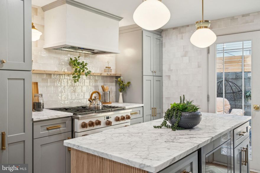 Welcome to 1918 S Camac St, a magnificent property located in the heart of Passyunk Square. This property boast two bedrooms and two and half baths, this residence offers a perfect blend of modern luxury and timeless charm. Step inside and be greeted by an open and airy floor plan, flooded with natural light that accentuates the high-end finishes throughout. The spacious living area is ideal for entertaining guests or simply relaxing with your loved ones. Gleaming white oak herringbone hardwood floors, recessed lighting, and large windows create an inviting ambiance that is sure to impress. The gourmet kitchen is a chef's dream, featuring top-of-the-line GE Cafe appliances, sleek carrara marble countertops and custom built range hood and white oak island. Whether you're hosting a dinner party or preparing a casual meal, this kitchen is equipped to handle it all. The adjacent dining area provides a seamless flow, making it easy to enjoy meals with family and friends. Retreat to the luxurious primary suite, complete with a spa-like en-suite bathroom. The  bathrooms have been meticulously designed with modern fixtures and finishes, providing a touch of elegance to your daily routine.  To top is all off you have a beautiful backyard with exterior tile work along with a fully finished basement. Don't miss the opportunity to make this renovated gem your own.