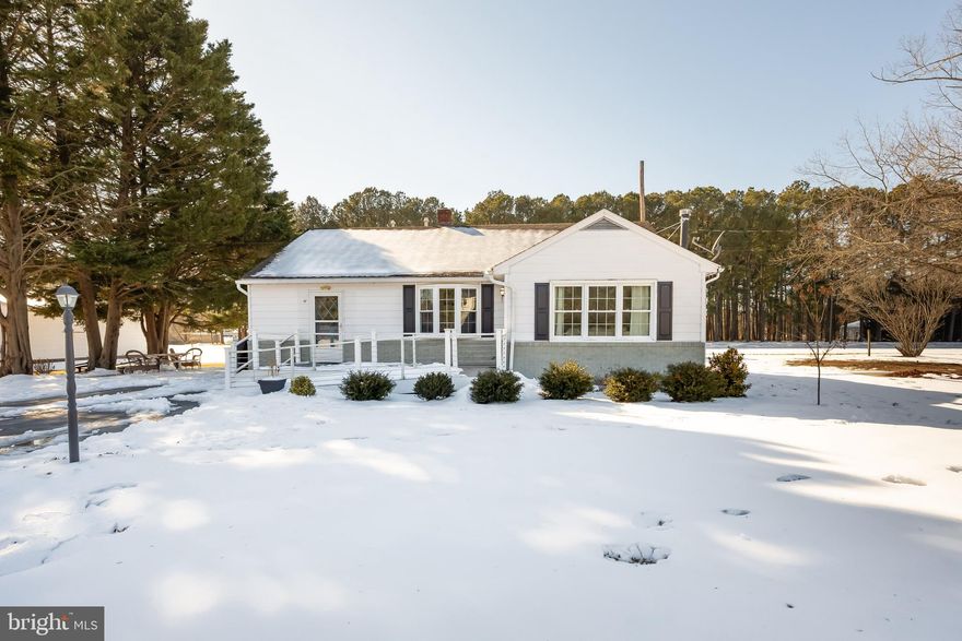 Adorable 1200+ SF Rancher in the quaint waterside town of East New Market. This well-maintained gem offers a spacious living room that still has a cozy feel with its gas fireplace and hardwood flooring. Enter the Kitchen/Dining Room area which continues with the theme of ample space and a cozy feel.  The bay window in the dining area and the continuation of hardwood flooring are adorable and the kitchen has updated appliances and is large enough for everyone on meal prep detail. Both Bedrooms are Spacious and the bathroom has been recently upgraded. The front deck features Trex decking material and a handicap accessible ramp. The yard is large enough for outdoor entertaining and has partial views of the Warwick River. The home is close to a local boat ramp for someone looking for a weekend retreat or this would be a great starter home for a lucky buyer. The septic was installed in 2022 and the Roof is approximately 5 years old. Schedule your showing today.