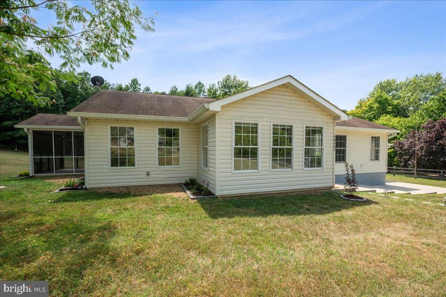 Welcome to 20663 Hermanville Rd! This move-in ready 3 bedroom 2 bath home near Pax River NAS sits on 1.4 acres with a beautifully updated primary suite, great outdoor living and room for pets. The home boasts an open concept with a large kitchen, adjacent dining space, a great flow. The living room is a perfect size and has a pellet stove for a cozy feeling in the winter. Off the living room is an important feature for many of us- a screened porch. The screened porch is a favorite spot for outdoor dining, lounging after a long day. There are two bedrooms and a hall bath, laundry/utility room leading to the primary suite. When you enter the primary suite you will note the spacious feel, natural light, and large walk-in closet. The primary bath has a dual vanity, custom tiled shower and a large soaking tub! Utilities have been recently upgraded to include new HVAC, replacement of the well pump and addition of water softener + UV filter.  On the rear of the house, there is an attached shed-shop that has power and a utility sink in place. You will not want to miss this opportunity, schedule your appointment today!