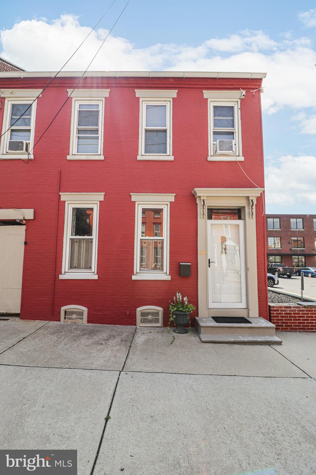 This end-unit townhome crams more than 2,000 square feet of charm, space, and updates smack-dab in the heart of Columbia Borough. You'll appreciate the original features, the 10-foot ceilings, and character that you can't find in newer homes. The kitchen has already been updated with new countertops, microwave, and dishwasher, so you can move in and start cooking without adding to your projects. Upstairs are all four bedrooms, along with a full bath; the laundry area is conveniently located on the first floor, so no lugging baskets down to the basement. Speaking of storage, there is extra storage in the dry, unfinished basement, and the walk-up attic is large enough for a fifth bedroom! Best part? With private parking in the back, you can walk to two parks, the post office, the Columbia Library, schools, and several antique marketplaces. Take a morning stroll to different coffee shops, a local bakery, or stop to eat at any of the local eateries. For those with a sense of adventure, you can rent an electric bike at the Columbia River Park and ride the River Trail to the White Cliffs, or walk to the Samuel Miller Mansion, home of My Haunted Mansion showing on Prime Video - it's all close by! If you're looking for space, character, and convenience, this one's worth a look!