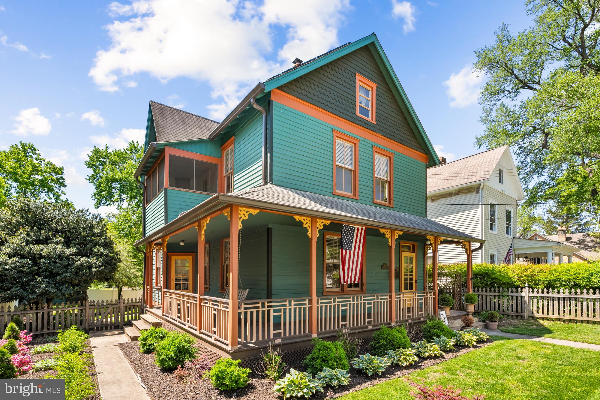 Lovingly-preserved Victorian story book home, known as the Miller-Spicknall House, an officially designated PG County historic site, recognized for its exemplary Queen Anne architecture. This 3-bedroom, 2.5-bath gem masterfully blends historic soul with thoughtful modern updates. Chair rail molding, intricate window and door casings, historic paint colors, and a rebuilt chimney (renovated in compliance with the Historic Society) pay homage to the home’s storied past. Natural light pours through large windows across the main level, where refinished hardwood floors and a newly-installed wood stove complement the designer farmhouse kitchen’s bead board cabinetry, marble countertops, and stainless steel appliances.
The charming wrap-around front porch overlooks a white picket fence and beautifully landscaped side gardens. The expansive rear yard welcomes sunny afternoons spent on the stone patio surrounded by flower beds and mature trees, while the playhouse / shed offers endless creative potential.
Three bedrooms, two full baths and a sun porch make up the second floor, including the generous primary suite featuring a beautifully updated bath with a classic clawfoot tub and heated towel racks. Full-height attic provides excellent storage or future living space, while the unfinished lower level offers even more flexibility.
Parking is accessible from the rear alley, backed by woods with a path leading to a 32-acre community park with tennis and pickleball courts, athletic fields, and the Hamilton Splash Park. Just minutes from Mt. Rainier and Hyattsville’s lively main business districts, offering easy access to dining, groceries, shopping, and cultural destinations. This beautifully-preserved piece of history awaits its next chapter.