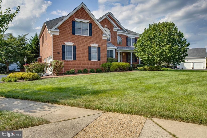 Great Value Over 5100 Finished Sq ft 3 Sides Brick with 3 Finished Levels .44 Acre Corner Lot with 3 Car Side Load Garage Hardwoods on Entire Main Level, Stairway and Upper Hallway Gourmet Kitchen w/Granite&Gas Cooktop 2 Story Family Room Back Staircase Luxury Master with 3 Closets&Sitting Room Princess Suite&Buddy Bath Finished Basement with Media Room,Full Bath&Finished WorkOut Room