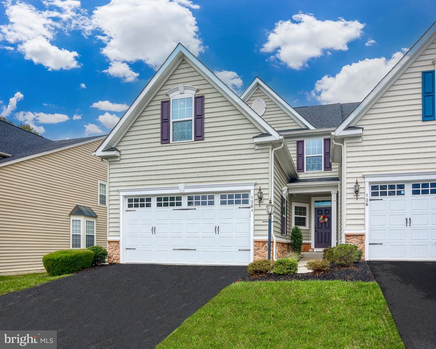 Enjoy low-maintenance living in this end-of-group villa located in the sought-after gated community of Bulle Rock. Designed for comfort and convenience, this home offers plenty of space with thoughtful features throughout. The main level includes a galley kitchen with a breakfast bar overlooking the dining area and living room, making mealtime and entertaining simple. The primary suite features a tray ceiling, walk-in closet, and private bath, while main floor laundry allows for easy single-level living. From the rear deck, take in the private wooded views. Upstairs are two additional bedrooms and a full bath with linen storage, perfect for family or guests. The finished lower level adds extra living space with a third full bath and generous unfinished storage areas. Living in Bulle Rock means more than just a home—you’ll have access to a clubhouse, indoor and outdoor pools, fitness center, tennis courts, walking trails, and a championship golf course right down the road. Lawn care and snow removal are included, giving you more time to enjoy everything the community and Havre de Grace have to offer. If you’re looking for a home that combines practicality, space, and an active community lifestyle, this villa is ready for you.