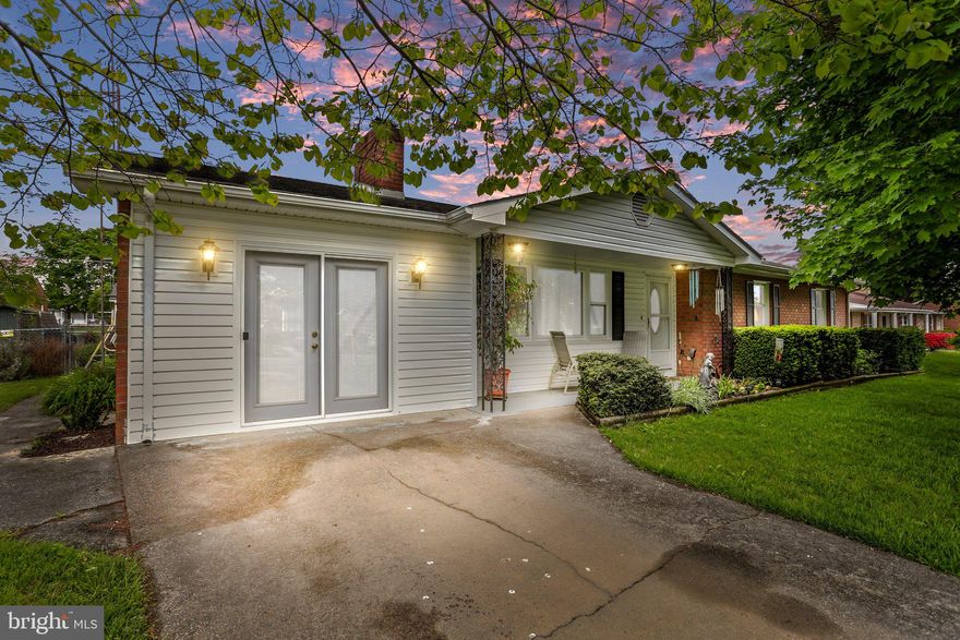 JUST REDUCED FOR QUICK SALE.  $1500 CARPET OR PAINT ALLOWANCE.  ONE LEVEL LIVING, CLOSE TO EVERYTHING!   THIS WELL MAINTAINED 3 BEDROOM, 2 BATH, BRICK RANCHER WITH A DETACHED 2 CAR GARAGE IS READY FOR A NEW OWNER.    KITCHEN HAS BEEN RENNOATED WITH STAINLESS APPLIANCES, NATURAL GAS COOKING STOVE,  SOFT-CLOSE CABINETS WITH PULL-OUT DRAWERS, AND UNDER-CABINET LIGHTING.    AN UNDER-SINK WATER FILTER HAS BEEN INSTALLED  FOR BETTER QUALITY DRINKING WATER,  AND FILTERED WATER ALSO RUNS TO FRIDGE.  WASHER AND DRYER HOUSED IN KITCHEN AREA TO AID IN MULTI-TASKING.  HARDWOOD IN DINING ROOM AND HALLWAY.   PRIMARY BEDROOM HAS BUILT IN CLOSET AND A FULL BATH.     THE ATTACHED ONE- CAR GARAGE WAS CONVERTED INTO LIVING SPACE, BUT HAVE NO FEAR, THE INSULATED TWO-CAR GARAGE BEHIND THE HOME PROVIDES TONS OF EXTRA SPACE FOR CARS AND STORAGE AND HAS ELECTRICITY ALREADY RUNING TO THE BUILDING.  AN ALLEY-WAY RUNS BEHIND THE HOME FOR ACCRSS TO GARAGE AND AND A GRAVEL PARKING LOT CAN HOLD 3 MORE CARS! THE BACK YARD FEATURES A COVERED PATIO OVER LOOKING BUTTERFLY BUSHES, PEONIES, PURPLE LILACS AND A VEGGIE GARDEN.  FULLY FENCED AND READY FOR THE KIDDOS OR PETS.  HOUSE SITS ON A RAISED CRAWL SPACE THAT HAS BEEN OUTFITTED, WITH 2 SUMP PUMPS, VAPOR BARRIER, AND A FRENCH DRAIN FROM MID ATLANTIC WATERPROOFING.   TERMINEX MAINTAINANCE CONTRACTALREADY PAID TO 2028.   WINDOWS REPLACED IN 2020.  HVAC REPLACED IN 2013.  NEW  ARCHITECTURAL SHINGLE ROOF 2009.   COMCAST INTERNET.  COME SEE IT QUICK BEFORE ITS GONE!  NO HOMESALE CONTINGENCY