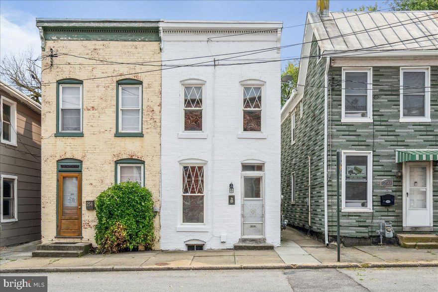 Phenomenal row home in the heart of downtown Frederick has been lovingly restored and brought up to today's highest standards. As you approach, you immediately notice the freshly painted brick and charming windows. Enter to gorgeous hardwood floors, high ceilings and nice line of sight. The front room is a cozy family room which flows nicely into a dining area and opens to the kitchen. The kitchen has been improved with new luxury vinyl flooring, stainless appliances and ample cabinet space. The kitchen flows seamlessly to the rear yard. Pride of ownership is evident in the rear yard with privacy fence, detached screened in area for gathering. Upstairs features two spacious bedrooms and a large shared bath. Laundry room has been brought upstairs which is exceptionally unique and convenient for downtown! The rear bedroom leads to a rear porch area and the front bedroom gets great natural light. Fresh paint throughout, new closet doors, updated light fixtures and thoughtful details throughout. Metal roof was re-coated by PJ's roofing recently. Street parking is readily available in this section of town. Ease of access to downtown favorites such as Showroom, Olde Mother, Attaboy Beer, Gravel and Grind and Common Market. This is an exceptional location and great value for downtown Frederick. Welcome home!! MULTIPLE OFFERS IN HAND--DEADLINE MONDAY at NOON PLEASE. THANK YOU!
