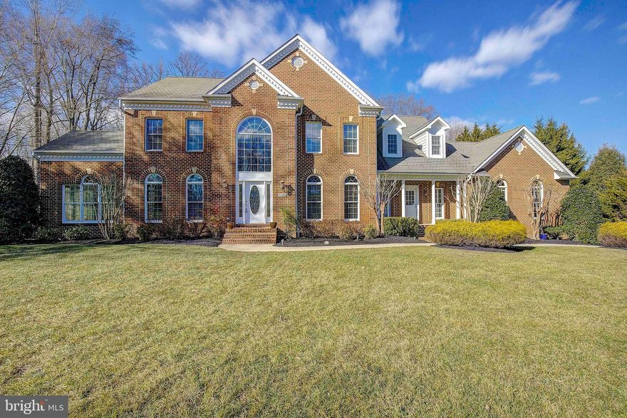 This stately colonial is situated on a gorgeous 2.17-acre homesite that sits on the 4th tee box of the Golf Club at South River.  The property offers a serene private setting with a massive tier deck, an in-ground pool, a hot tub, and waterfalls. Plenty of parking on the extended driveway and 3-car garage. This is one of the community's largest floor plans, offering nearly 7,000 square feet of living space. The expansive main level offers an open foyer, formal dining and living rooms, a sunroom, an in-home office, and a family room with a gas fireplace. The centerpiece on this floor is the gourmet kitchen with ample counter space and a large breakfast room. The conveniently placed laundry room is right off the kitchen with a second entrance, mud room, and a half bath. The upper level offers four generous bedrooms and three full baths, including a vast primary bedroom with a recently remodeled master bath and gas fireplace. Fresh carpet has been installed throughout the property, and all the bathrooms have been upgraded. The entire interior has been recently painted. The home is complimented with a fully finished lower level that provides a 5th bedroom, 4th full bath, huge rec room, built-in bar, and large exercise room. This fantastic property is perfect for entertaining and can support large gatherings.