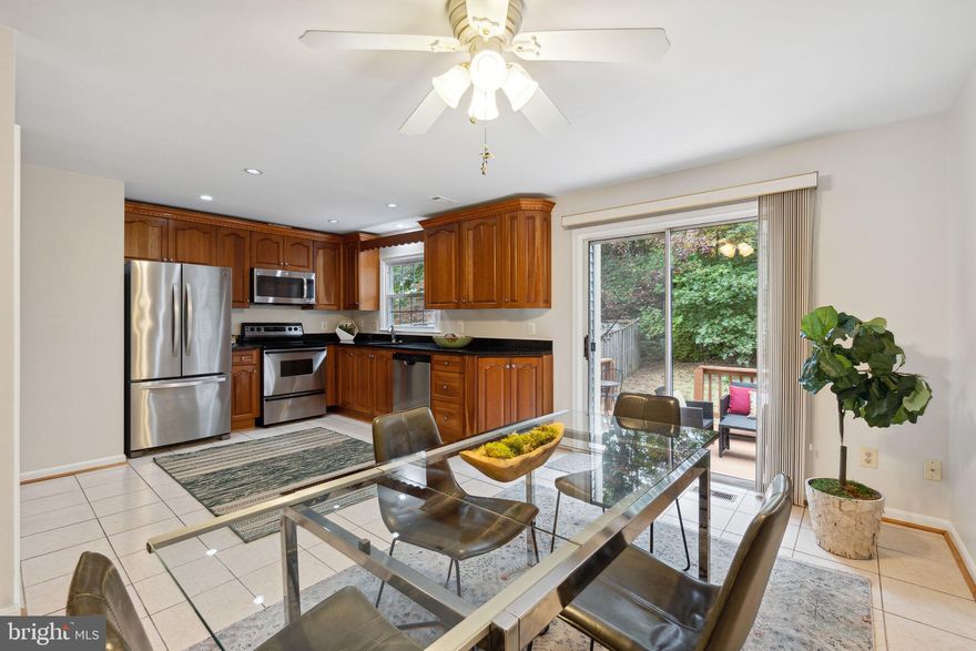 Welcome to this lovely townhome on a calm, cul-de-sac block!  Prepare delicious meals in the ample eat-in kitchen with granite counters, cherry cabinets and stainless appliances.  Enjoy alfresco cooking and dining on the rear deck immediately off the kitchen.  There are beautiful hardwood floors in the living and dining areas, as well as in all of the bedrooms.  The primary bedroom suite easily accommodates a king-size bed with plenty of room for additional furniture, and has its own ensuite bathroom.  The other two bedrooms on the second level are both large enough for queen-size beds, and they are served by a full bathroom in the hallway.  The lower level is partially finished with a rec room, wood burning fireplace and high ceilings.  There is an area immediately across from the stairs where a third bathroom could easily be added on the lower level if one is desired.  Currently this area and the adjacent utility/laundry room provide plenty of storage with custom-built shelving.  Access to the Paint Branch Trail is located less than two blocks from this townhouse via a wooded path.  Serpentine Playground is also less than a two block walk away.  Shopping and restaurants are an easy drive from this move-in ready home, including the new White Oak Town Center currently under construction.  This home shows beautifully, so come take a look!