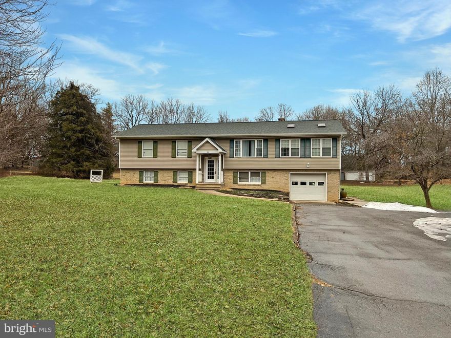 Welcome to your next adventure in homeownership! Tucked away in beautiful Shepherdstown, WV, this spacious 4-bedroom, 3-bath home is ready for a new family to make it their own. With a bit of elbow grease and creativity, this property could become your private oasis—complete with a fenced-in pool that’s perfect for summer splashes and weekend pool parties.

You'll love the convenience of the attached two-car garage, plus there's an extra detached workshop/garage out back—ideal for hobbyists, DIYers, or anyone who needs extra storage.

Inside, the kitchen features sleek granite countertops, while LVP flooring adds modern style to the main level. Downstairs, the midcentury-style basement is a cozy spot with plenty of character—just waiting for your personal touch.

Sure, this home needs a little love, but imagine the value you could build with some sweat equity. Don’t miss the chance to explore the endless possibilities—schedule a tour and see what this gem could become!  Please note that I have taken the liberty of virtually staging a few rooms to help your vision come alive. (They are labeled)

Being sold AS IS—bring your vision and make it shine!