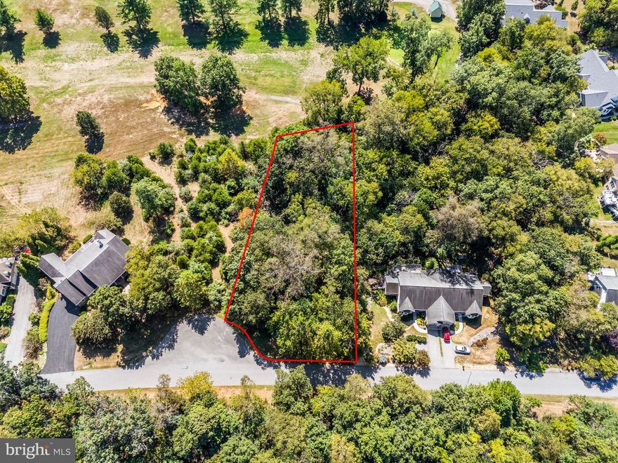 Tucked within one of the Eastern Panhandle’s most sought-after communities, Lot 107 on Reachcliff Drive presents a once-in-a-generation opportunity to build your custom home in Fernbank—known for its natural beauty, welcoming neighbors, and golf course setting. This lot provides 89' of frontage along the 5th fairway. 

Positioned at the highest elevation in the neighborhood, this wooded lot offers spectacular views of the Cress Creek Golf Course and protected countryside beyond. Located on a quiet cul-de-sac, Reachcliff Drive is prized for its peaceful atmosphere and refined homes valued up to $1M.

With public water, sewer, and cable available, and a topography that supports a sunny walkout basement, this lot is ready for your architect and builder. The generous depth allows for privacy while still enjoying sweeping views and golf course access.

Just minutes from the Potomac River, downtown Shepherdstown, and MARC commuter rail to DC, Fernbank offers an ideal blend of tranquility and convenience.

Don’t miss your chance to own one of the premier homesites in the region.