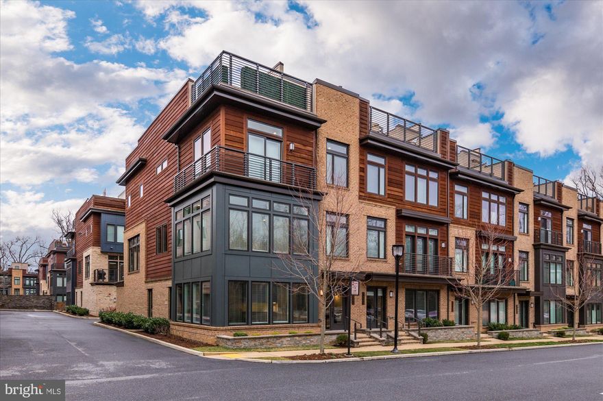 Experience luxury living at Grosvenor Heights. Built in 2019, this spectacular end unit is the largest model available in the coveted Bethesda, Maryland community. Spread over four levels, this four bedroom, three and a half bathroom home offers over 3,300 square feet of beautifully designed space. The stunning open floorplan on the main level, fabulous roof deck and high ceilings throughout are just a few of the finer touches that make this home so desirable. The entry level welcomes you with gorgeous hardwood flooring that can be seen throughout the home. This level hosts a bedroom, full bathroom, and a den with a wet bar, providing the perfect space for lounging or those who want their own private living area. An elevator, conveniently placed by the garage, makes grocery trips a breeze. This level offers a two-car garage, storage space and ample natural light. The main level boasts an open floor plan with a gourmet kitchen complete with top-of-the-line appliances such as a Sub Zero refrigerator and wine fridge, Thermador five-burner gas cooktop with hood, and a Bosch dishwasher. The oversized island is perfect for entertaining and additional bar seating can be found to the side of the room. Cabinet space is endless and “sky-high,” offering storage for all of your items. The open living area hosts a gorgeous stone fireplace and offers enough space for an office area. Natural light beams through the oversized windows that surround this room and the balcony can be easily accessed off of the living area.The dining room, wrapped in windows, offers bright and sunny views and is the perfect space to host a larger group. A powder room and hall storage closet round out this main level.
The upper level hosts three bedrooms and two full bathrooms. The generously sized primary suite showcases a spacious bathroom with a custom tile walk-in shower, dual vanities and soaking tub. Two spacious walk-in closets with built-in shelving complete this room. Two additional bedrooms can be found on this level, sharing a hall bathroom with a shower and tub. The newly updated laundry room is perfectly situated down the hall with built-in cabinetry and a sink. The top level roof deck is the “wow” space you have been looking for. Complete with a stainless steel Viking beverage refrigerator, wet bar, cabinet space, mounted TV and surround sound, this level has all of your entertaining needs covered. This level is large enough to host a larger dining table and lounge seating throughout. Conveniently located just minutes away from the Wildwood Shopping Center, I-495 & I-270, Grosvenor Metro Station, downtown Bethesda and Pike & Rose, this home could not be more ideally situated. Don’t miss this fantastic opportunity to own a stunning home in one of Bethesda’s most sought after communities.