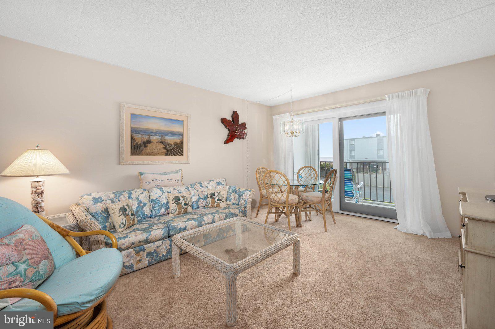 Welcome to your oasis by the sea. This ocean block condominium has beach access mere yards away and is your ideal summer respite. Situated in the heart of Ocean City, Maryland, this property is easily accessible to restaurants, shopping, night life and family entertainment. Outlet shopping is only 30 minutes away. This is a quaint, efficient unit is being offered for sale by its original owner and has recently been refurbished with an updated kitchen, carpeting, paint and window treatments. The furnishings are tasteful, ideally chosen and are being included with the sale. The primary bedroom is large and filled with natural light, has balcony access and an adjacent half bath. There is an additional room in the front of the unit that is easily suited as a bedroom, home office, crafting room or additional sitting area. The full bath has both a tub and shower as well as new cabinetry. An en suite washer and dryer set offers yet an additional convenience. This community offers covered, dedicated parking and a secure storage area. Storm shutters have been installed on the balcony of the unit that provide additional protection from the elements. This unit is a moment of peace in an otherwise frenzied world. Schedule your visit today!