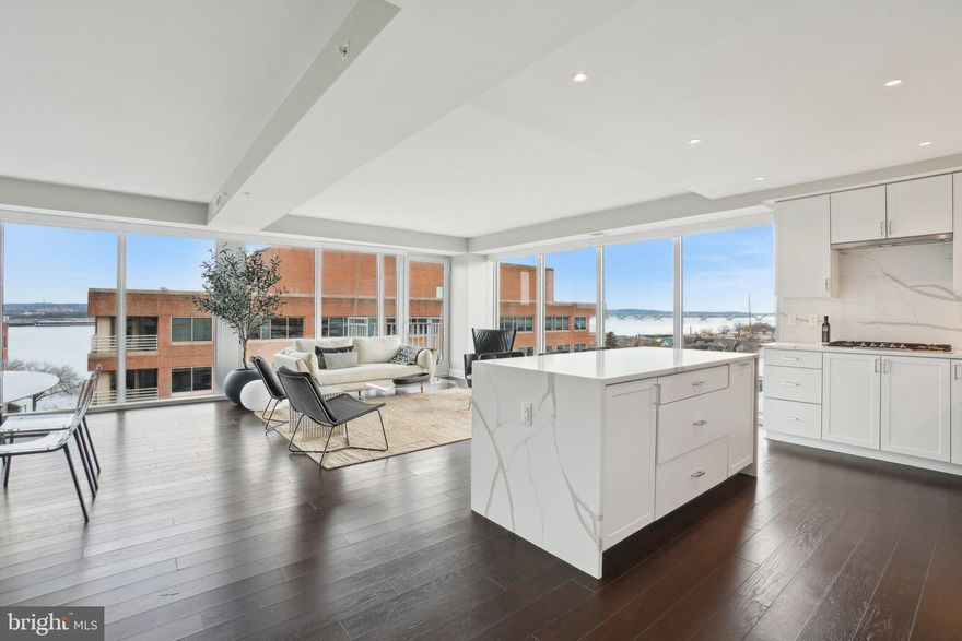 Welcome home to a rarely available Two Bedroom + Den corner unit at Venue, one of Old Town Alexandria's newest luxury condominium developments by Carr Companies. Located at 925 North Fairfax Street, Unit 601 offers an elegant lifestyle with breathtaking water views and extraordinary finishes.

Spanning 1,800 square feet, this expansive floor plan is thoughtfully designed to maximize both space and light. The Southeast corner positioning allows for stunning views of the Potomac River through floor-to-ceiling windows in every room, creating a serene backdrop to your daily life. The open-concept living area is both spacious and inviting, perfect for hosting gatherings with seating and dining space for up to 10 guests.

The chef's kitchen is a masterpiece, featuring a premium Bosch appliance package, Quartz countertops and matching backsplash, and custom cabinetry, ensuring both functionality and style. Wake up to water views in the owner's suite, a luxurious retreat, complete with an en-suite bath that boasts a double vanity, a walk-in shower, and Bianca Carrara marble walls and floors. Storage is abundant, with six closets throughout the unit, including a spacious walk-in closet in the owner's suite, a linen closet in the powder room, and an extra-large closet in the foyer. 

Step outside to your east-facing balcony and enjoy views of The Capitol, or take advantage of the community's exceptional amenities. Venue offers a hotel-style Porte-Cochere entry, a grand lobby with a full-service concierge, and an on-site building manager. The rooftop terrace provides expansive panoramic views of the DC Monuments, Potomac River, and Old Town skyline, complete with an outdoor grilling station and fire pit seating area. The indoor Sky-Lounge is elegantly appointed with flat-screen TVs, a fireplace, and a cocktail bar, ideal for hosting gatherings. For wellness enthusiasts, the state-of-the-art fitness center includes a Barre studio, and for pet lovers, the pet-friendly community offers a pet spa right next to a secure bike storage room.

Situated in the heart of Old Town's most desirable neighborhood, Venue Condominiums offers a turn-key elevated lifestyle with direct access to the Mount Vernon Trail and proximity to entertainment, dining, and shopping. Discover the perfect blend of sophistication and convenience in this remarkable home.

All information deemed reliable but not guaranteed. Buyer to verify all information.