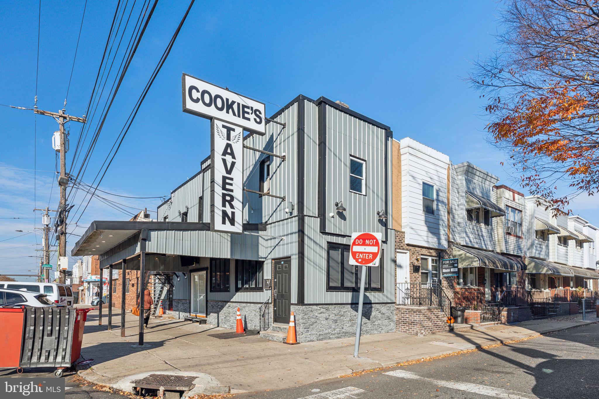 Welcome to this exceptional mixed-use property (approx 2430 SqFt) in the heart of South Philly at the heavily traveled intersection of 10th & Oregon Ave - Ideal for entrepreneurs and residents alike, this one-of-a-kind tavern offers a prime location, versatile spaces, and a wealth of opportunity. Located on the ground floor, this stylish neighborhood tavern is just minutes from the sports complex, public transportation, and local attractions like casinos, it’s a hotspot for both locals and visitors. The recently renovated space features an inviting atmosphere with modern décor, a spacious outdoor area, and room for craft cocktails and live entertainment. The kitchen is full of commercial cooking equipment, ready to be put to use. Additionally, there’s a bonus upstairs area perfect for private events, which could easily be converted into an additional residential unit. Whether you're enjoying a night out or hosting a special gathering, this tavern provides the ideal setting. Above the tavern, is an apartment and next to the bar is a duplex residence offering two spacious 1-bedroom apartments with private entrances. With its ideal location, residents can enjoy easy access to diverse dining, shopping, and entertainment options, as well as excellent public transportation links. Whether you're looking to invest in a thriving business or seeking a versatile property with rental potential, this mixed-use building offers the perfect balance of commercial success and residential comfort. Don’t miss your chance to own a piece of South Philly's dynamic landscape. Taxes and square footage are the responsibility of the buyer to have verified. Liquor license not included in this price but could be considered for an additional fee.
Property features a canopy and zoning that may require compliance review or a use variance. The existing duplex configuration is non-conforming and not currently registered. Buyer is responsible for conducting due diligence with the appropriate authorities regarding any necessary modifications, approvals, or potential changes to use.